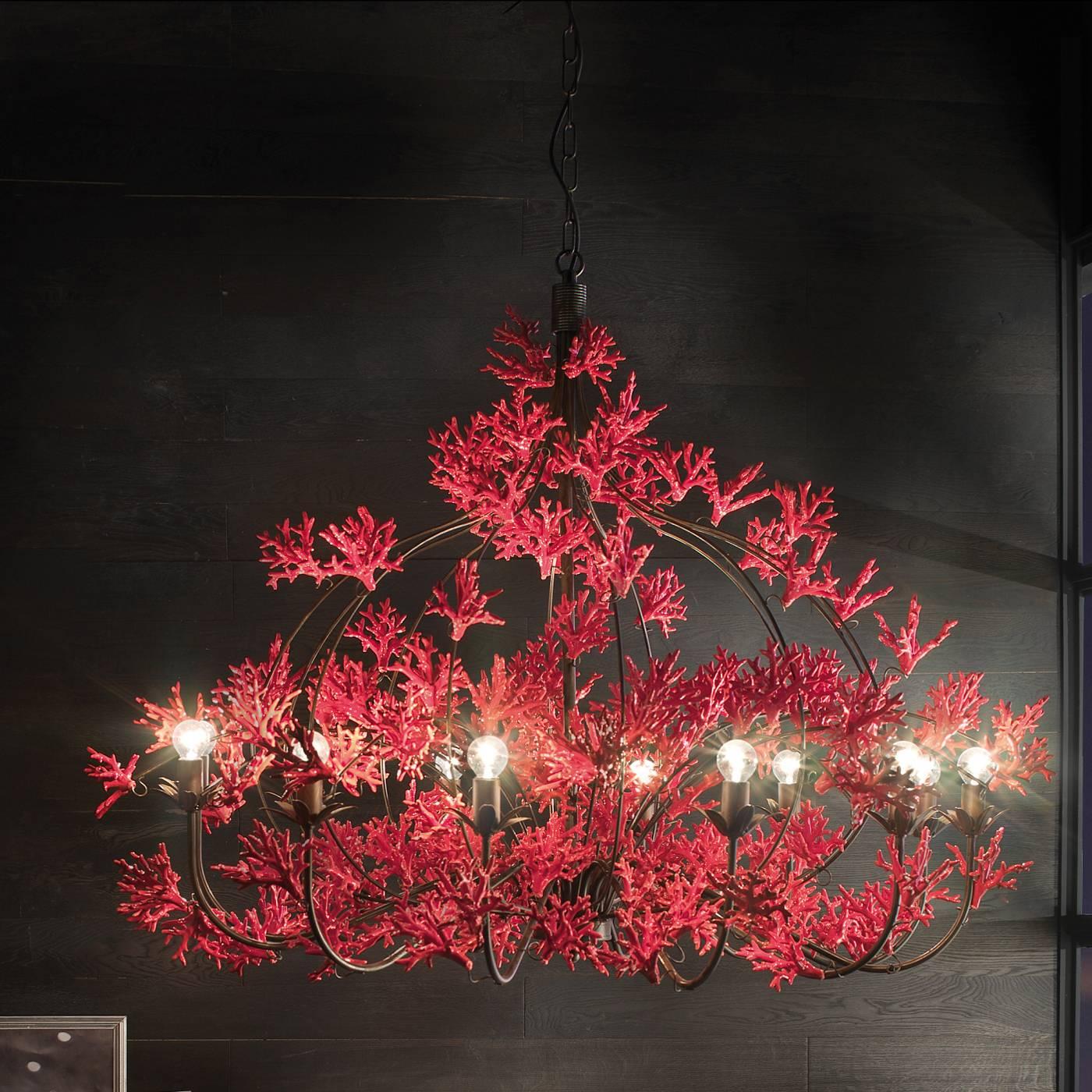 This chandelier features an extraordinary design and construction that is unlike any other. Its elegant metal frame almost disappears under the exquisite 140 handcrafted red ceramic coral branches giving them the appearance of floating. The nature