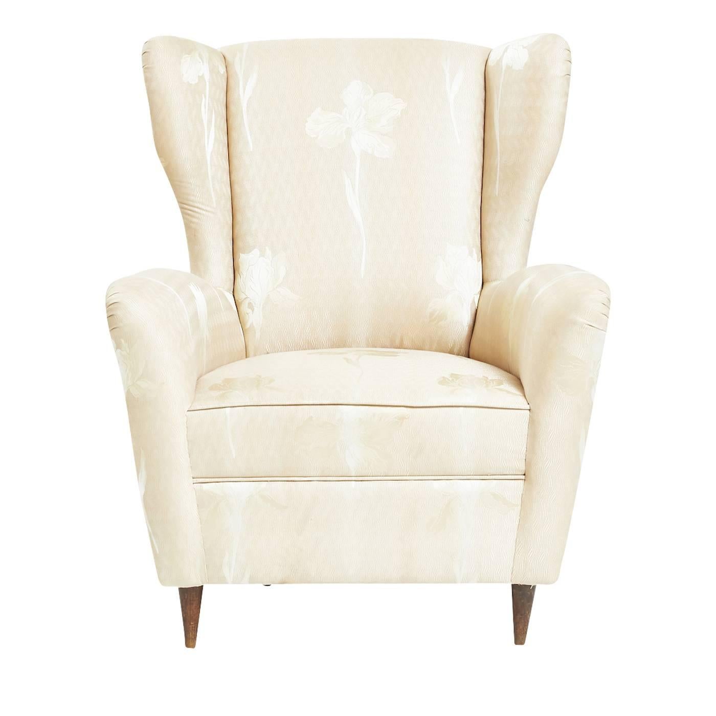 This exquisite armchair's design is inspired by the elegance of the early 20th century furniture. What makes it a uniquely modern piece is the fact that the precious fabrics that cover its cushions are a combination of Japanese silk, jute, Venetian