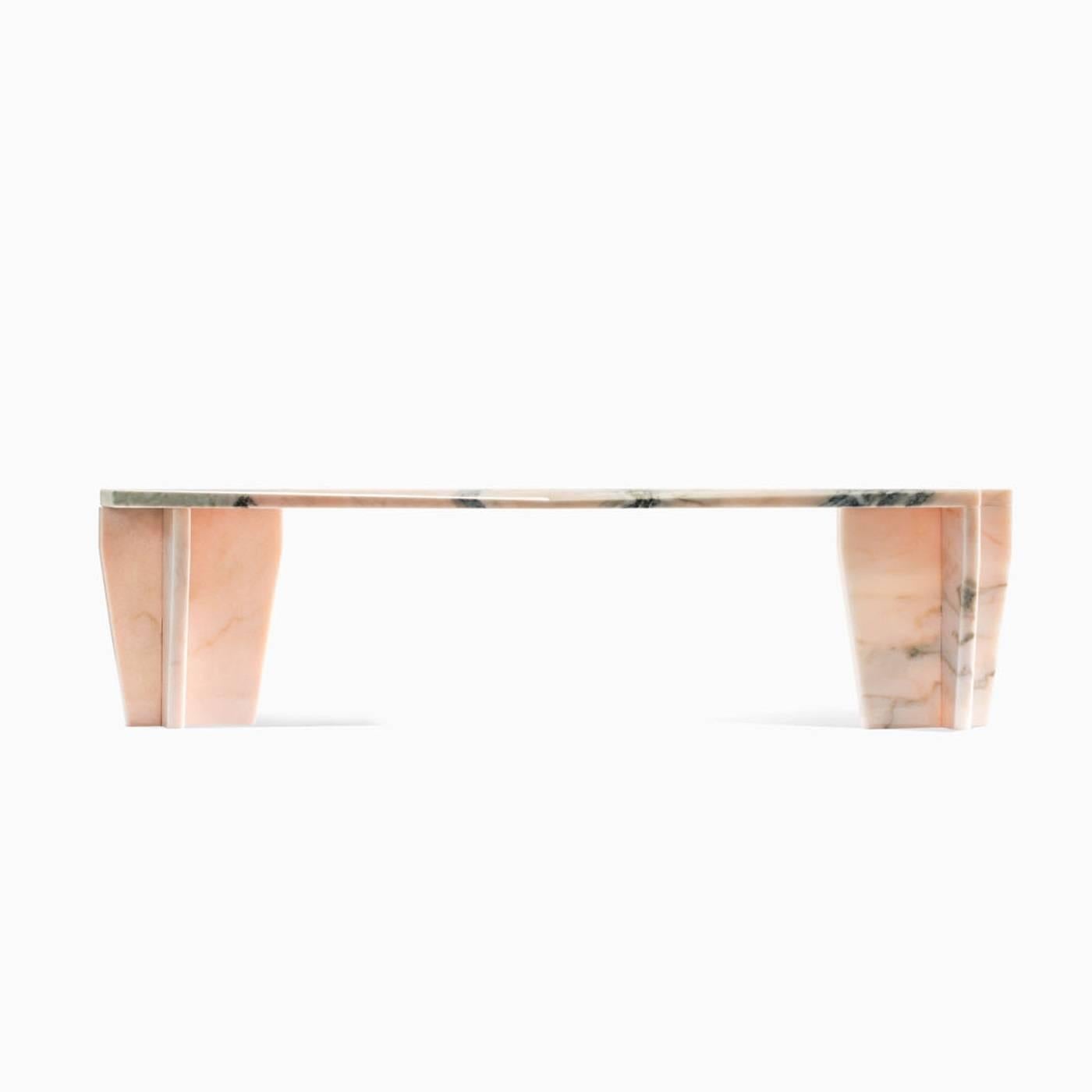 This coffee table features two short legs and it is entirely made of 2 cm. thick pink Portugal marble. Part of the Z-series, this table uses a special dry joint without any glue or screws. It is possible to have different kinds of marbles upon