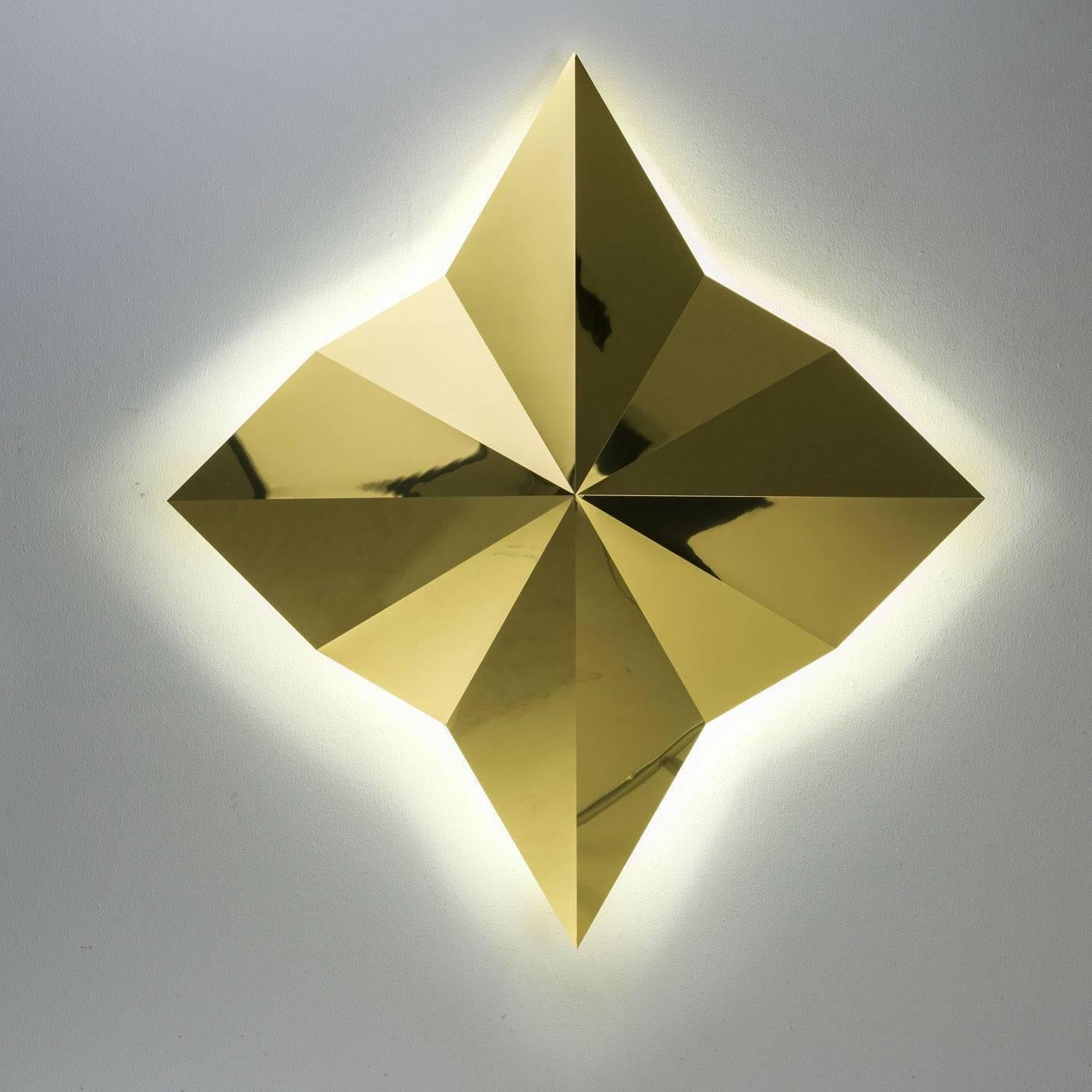 This lamp has a multidimensional diamond shape achieved using a precise technique requiring a CNC milling machine. Sheets of brass are carved, replicating proportions stemming from the sacred study of geometry. Through this process, a state of