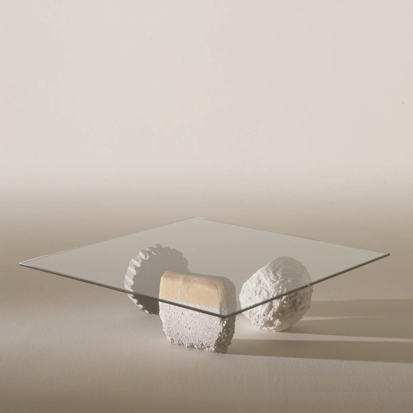 Inspired by the youthful memories of the designer, materials is a table base made of fragments from the past: a sphere of alabaster, a cogged wheel made of sandstone and a fragment of wall of brick and cement, smoothed by river water over decades.