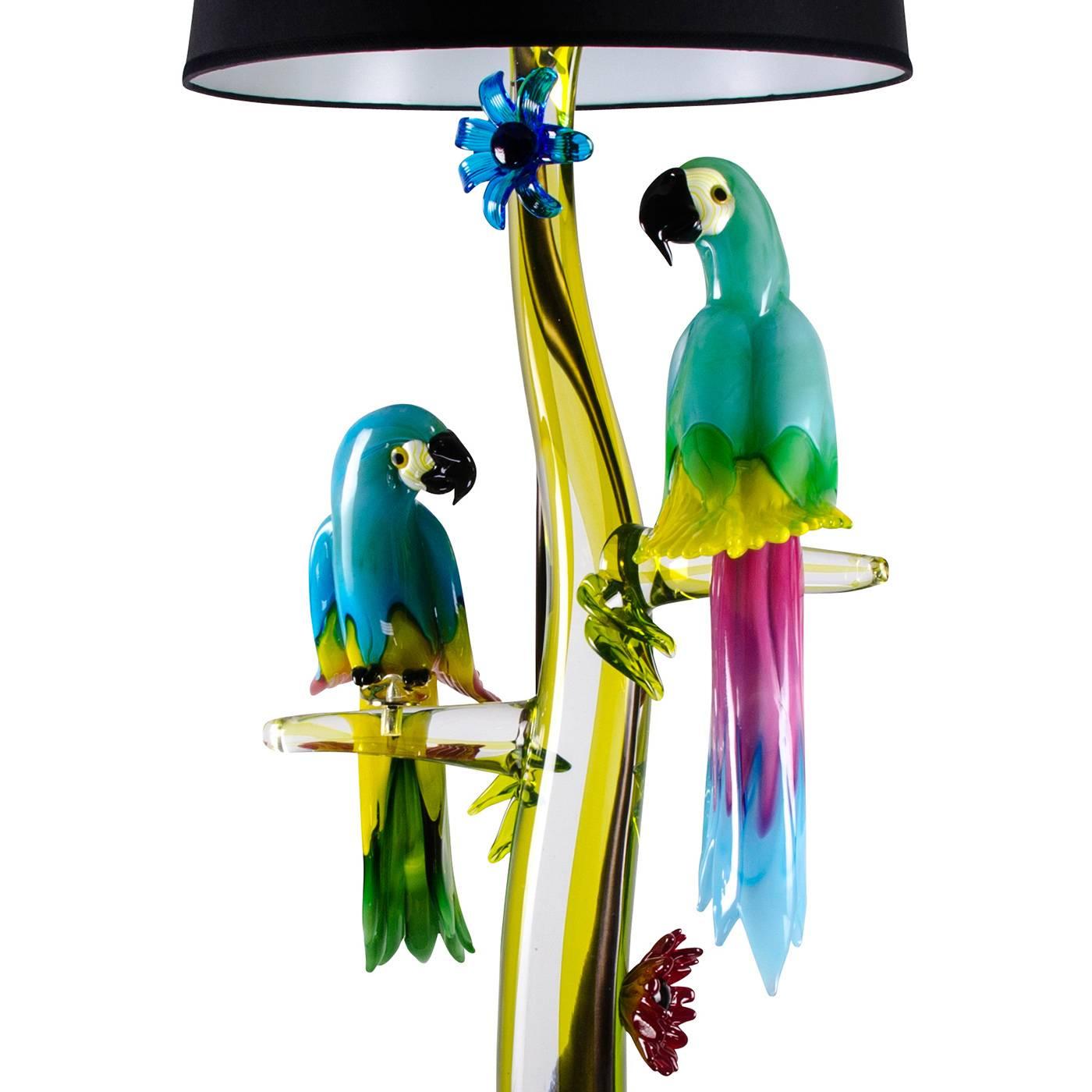 This incredible floor lamp with three Macaw parrots is entirely handmade by the master glass blower Zanetti on the island of Murano in Venice. Remarkably animated and colorful, these birds are made of solid glass and perch on a clear glass branch