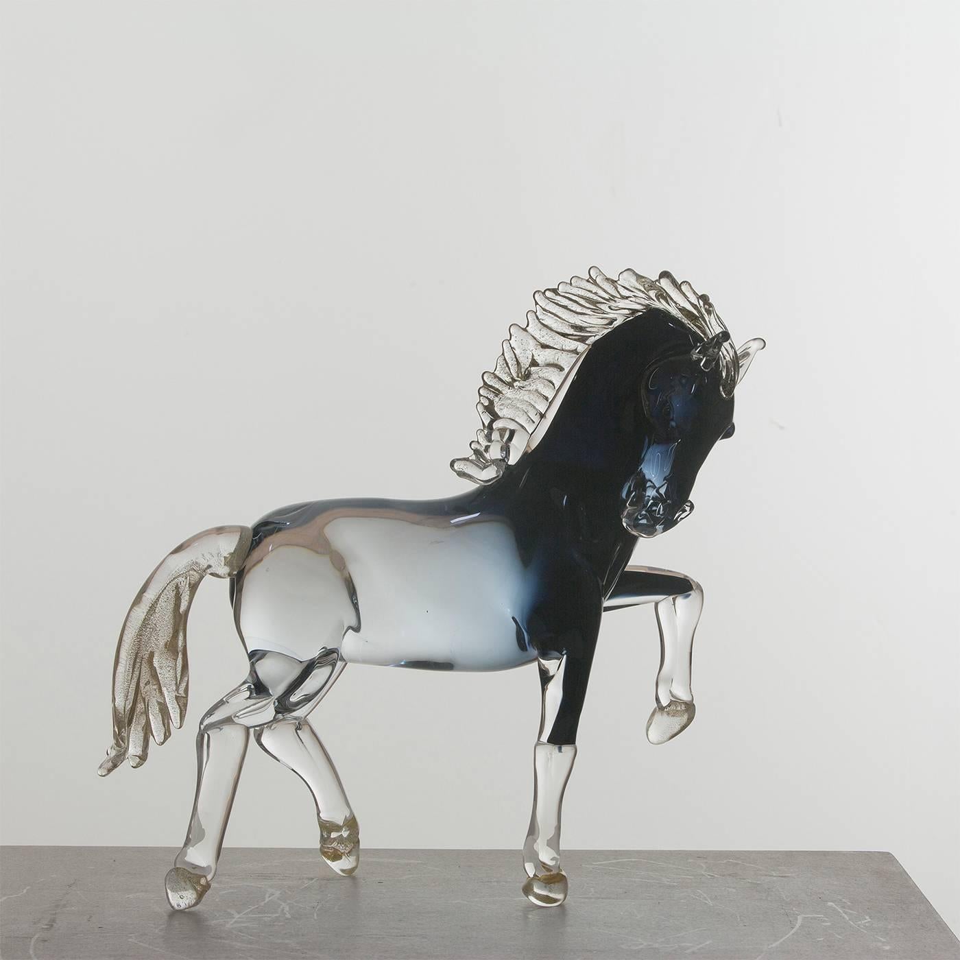 This exceptionally animated small prancing horse is entirely handmade by the master glass blower Zanetti on the island of Murano in Venice. The mane, tail and hooves have 24-karat gold details, while the shaded black glass of the body features