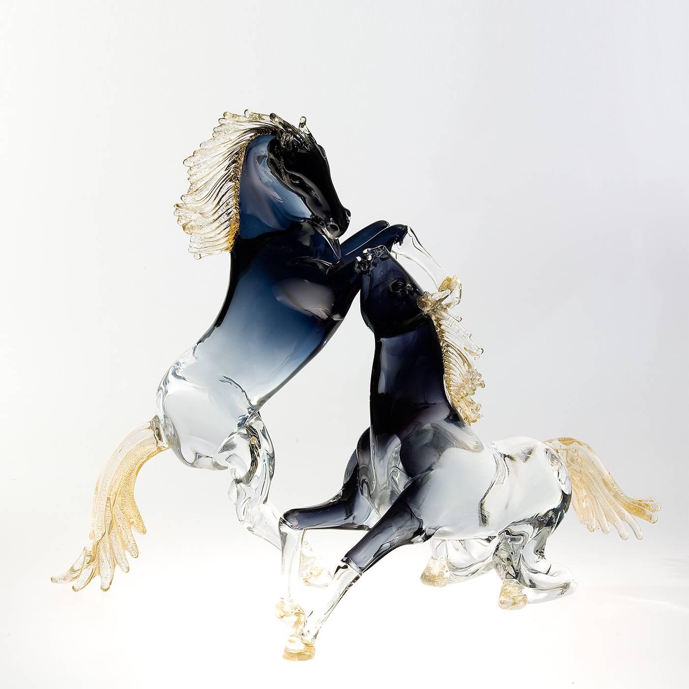 This exceptionally animated large rearing horse is entirely handmade by the master glass blower Zanetti on the island of Murano in Venice. The mane, tail and hooves have 24-karat gold details, while the shaded black glass of the body features subtle