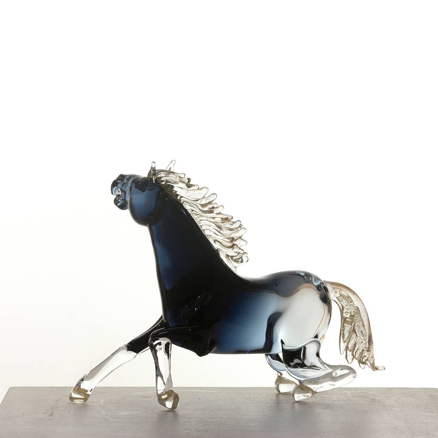 This exceptionally animated large sitting horse is entirely handmade by the master glass blower Zanetti on the island of Murano in Venice. The mane, tail and hooves have 24-karat gold details, while the shaded black glass of the body features subtle