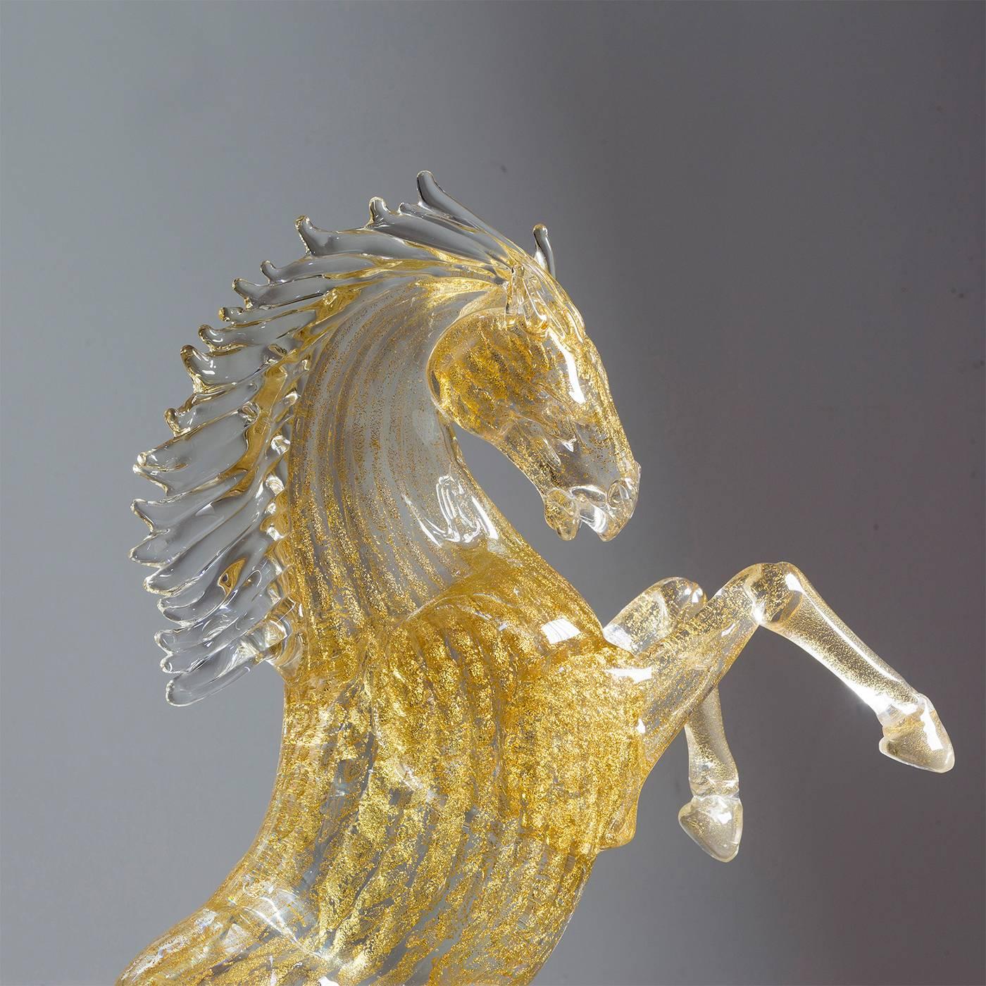 This exceptionally animated small rearing horse is entirely handmade by the master glass blower Zanetti on the island of Murano in Venice. The mane is clear while the body, tail and hooves have 24-karat gold leaf throughout. Make a dramatic
