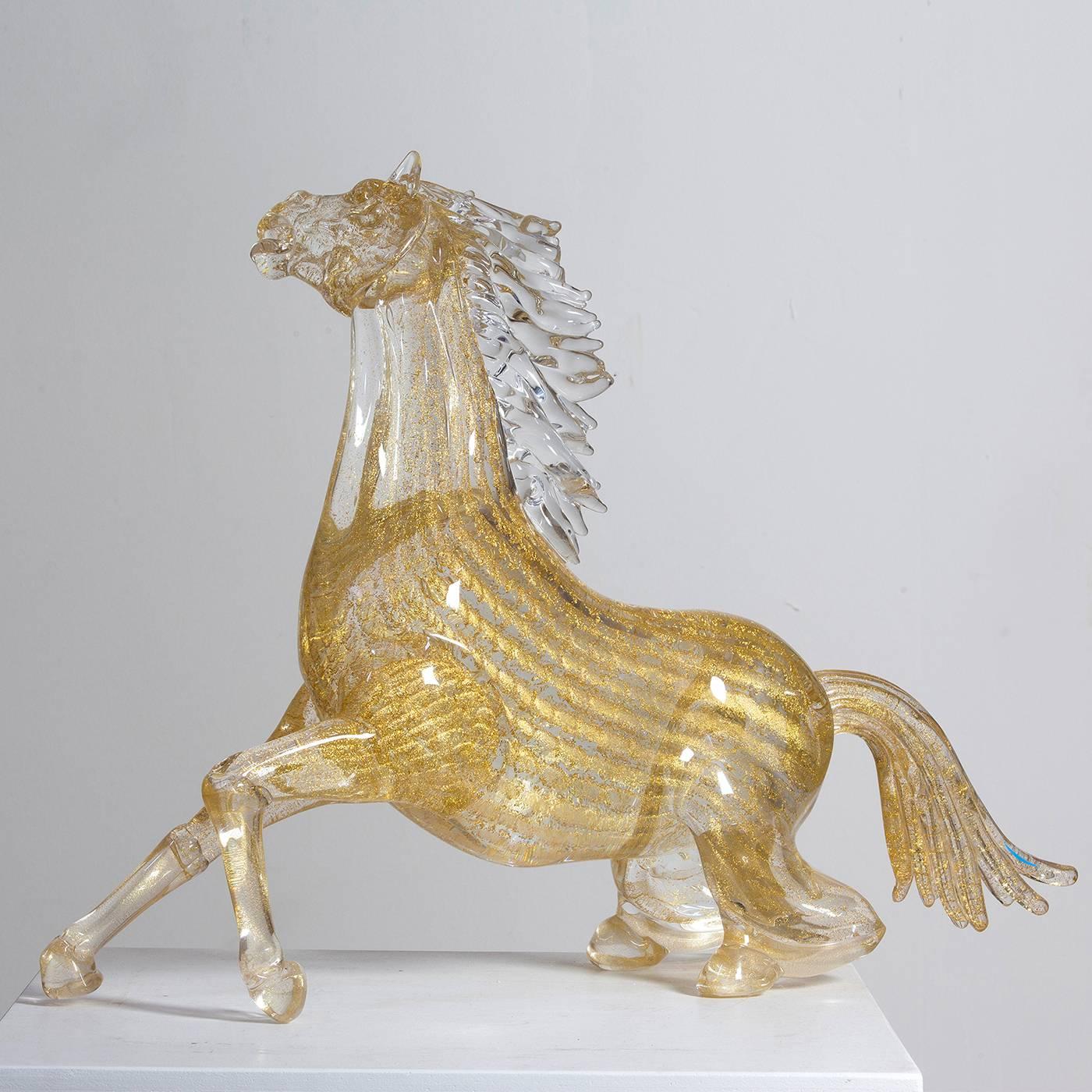 This exceptionally animated small sitting horse is entirely handmade by the master glass blower Zanetti on the island of Murano in Venice. The mane is clear while the body, tail and hooves have 24-karat gold leaf throughout. Make a dramatic