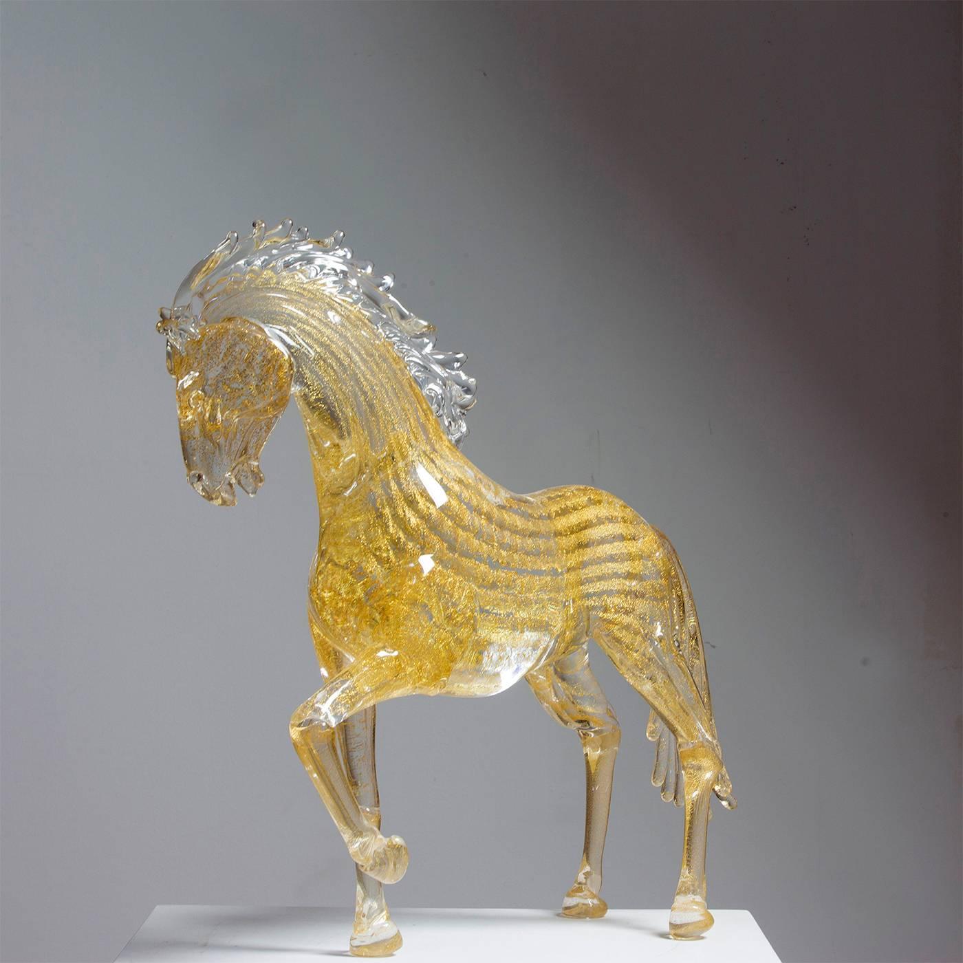 This exceptionally animated small prancing horse is entirely handmade by the master glass blower Zanetti on the island of Murano in Venice. The mane is clear while the body, tail and hooves have 24-karat gold leaf throughout. This piece makes a