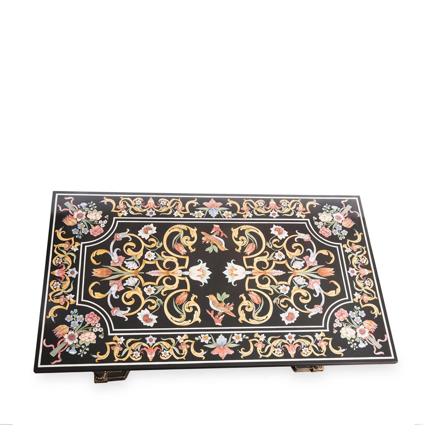 Richly-decorated tabletop made of black slate featuring a coral flower and yellow bird motif in a polychrome scagliola inlay inspired by an 18th century original. The polished finishing and the flawless carved wood support add to this ornate