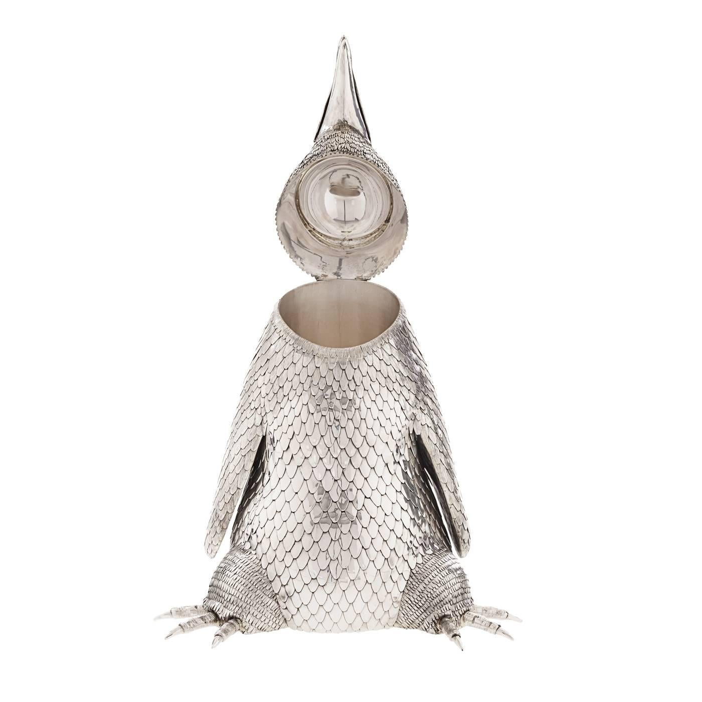 This is a sterling silver champagne bottle holder playfully modeled after a penguin. Its true-to-life quality is remarkable and makes it a very unique protagonist of important dinner tables. The piece is handcrafted with long hours of work and