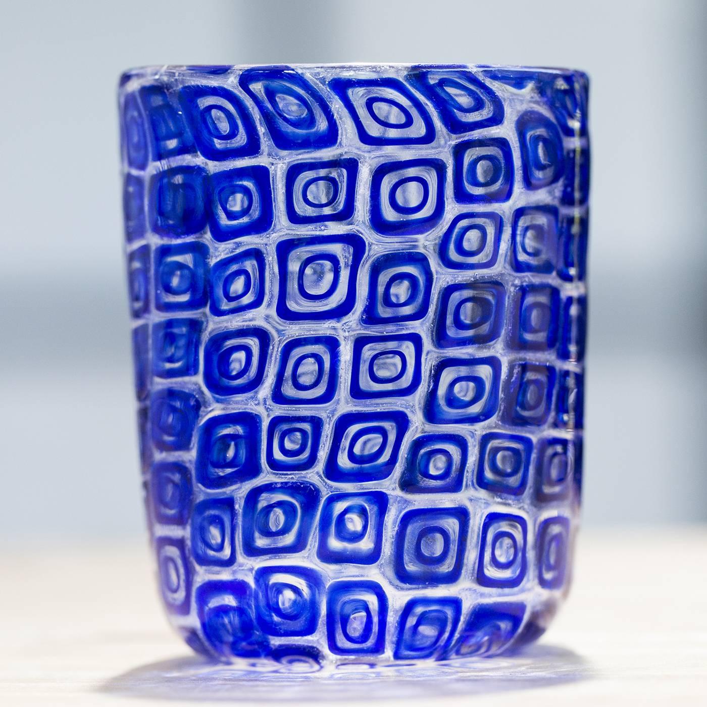 Set of six blue glasses made with the 'Piera' technique, which entails the melting of murrine (the small single elements) into a clear glass base. These glasses are in limited supply because they are made with antique murrine. Made entirely by hand