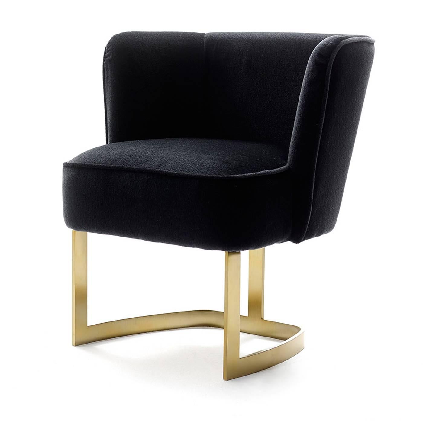 This luxurious seat is mounted on a brass frame with a horseshoe design and features polyurethane padding upholstered with fine black velvet. Designed by Studio 63.