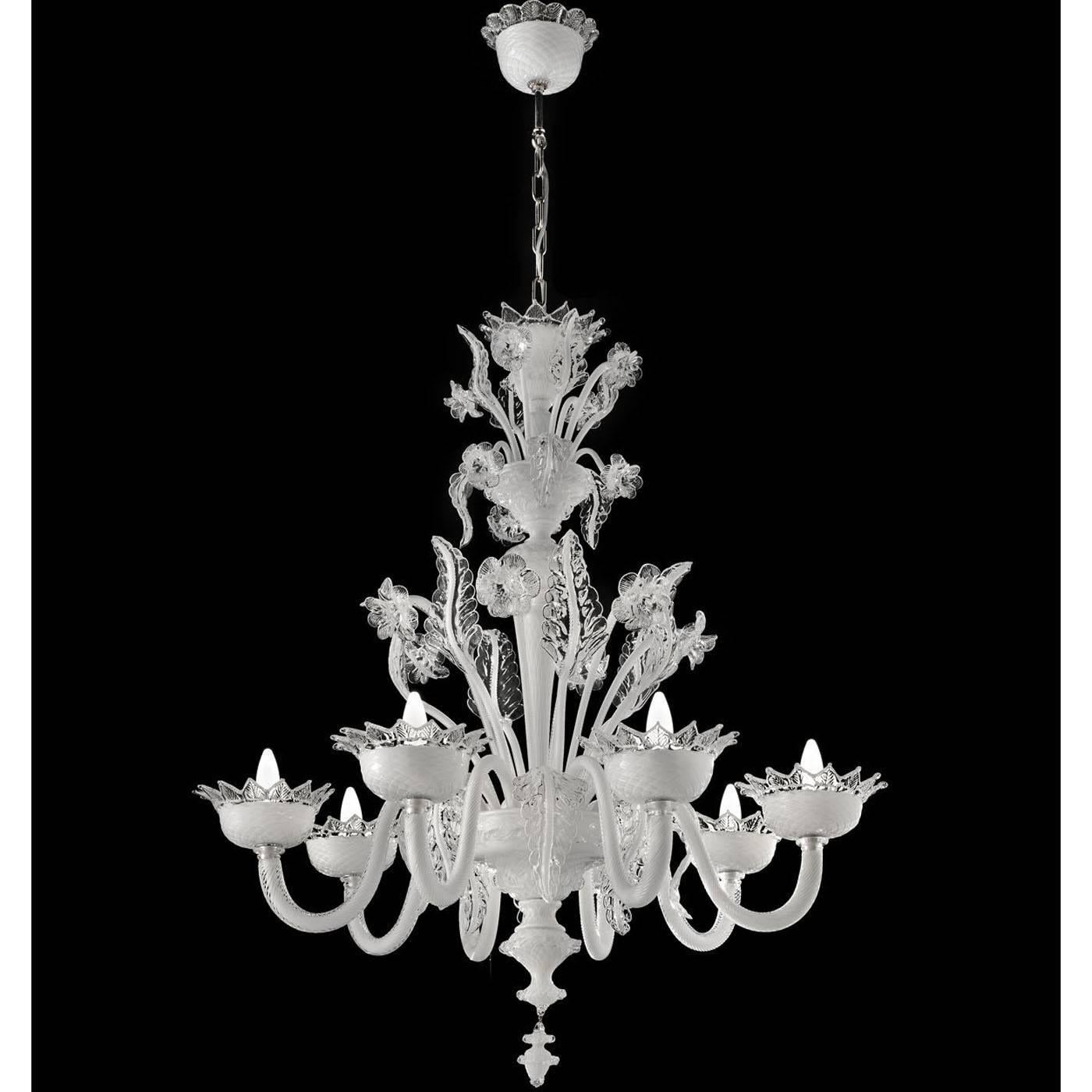 This elegant chandelier is entirely made in Murano glass with six lights supported by sinuous glass arms and adorned at the top with a spectacular decoration of flowers and leaves. This unique object reproduces a 19th century original and its metal