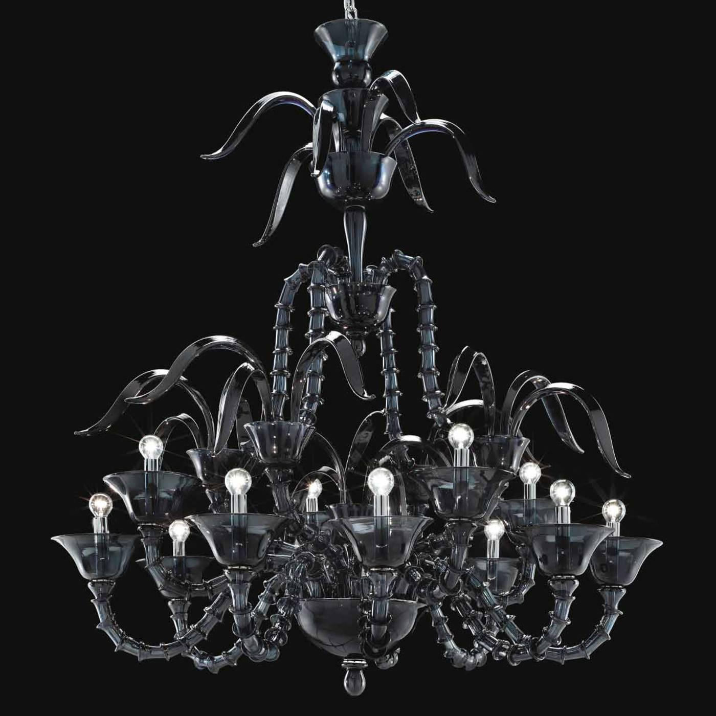 This twelve-light chandelier is entirely mouth-blown in Murano glass in the 'Rezzonico' style, which originated in the 18th century in Venice. The jointed arms and Cascade of the top decorations are in striking black, giving this Classic piece a