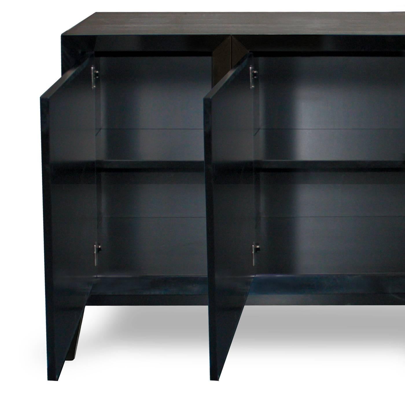 This four-door sideboard is beautifully crafted by the finest Italian artisans and is finished in a hard, super sleek black gloss lacquer. The wooden handle in the shape of half-spheres adds subtle glamour.