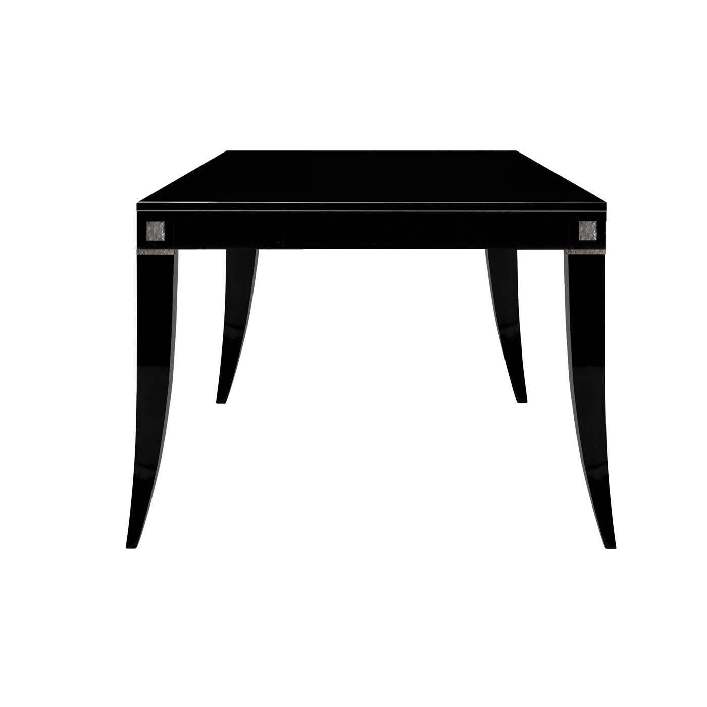 This table with its Minimalist look has a modern design with a timeless elegance. Its rectangular top is supported by four elegantly curved legs, all finished with a matte black lacquer.

