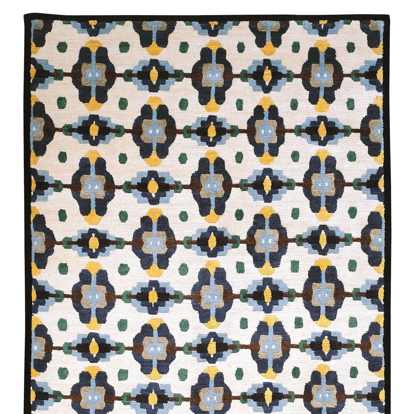 This elegant wool carpet is part of a 36-piece limited series designed by George J. Sowden, who also signed each piece. Because it was entirely handmade (from the harvesting of the Tibetan wool to its knotting and the final steps of finishing), this