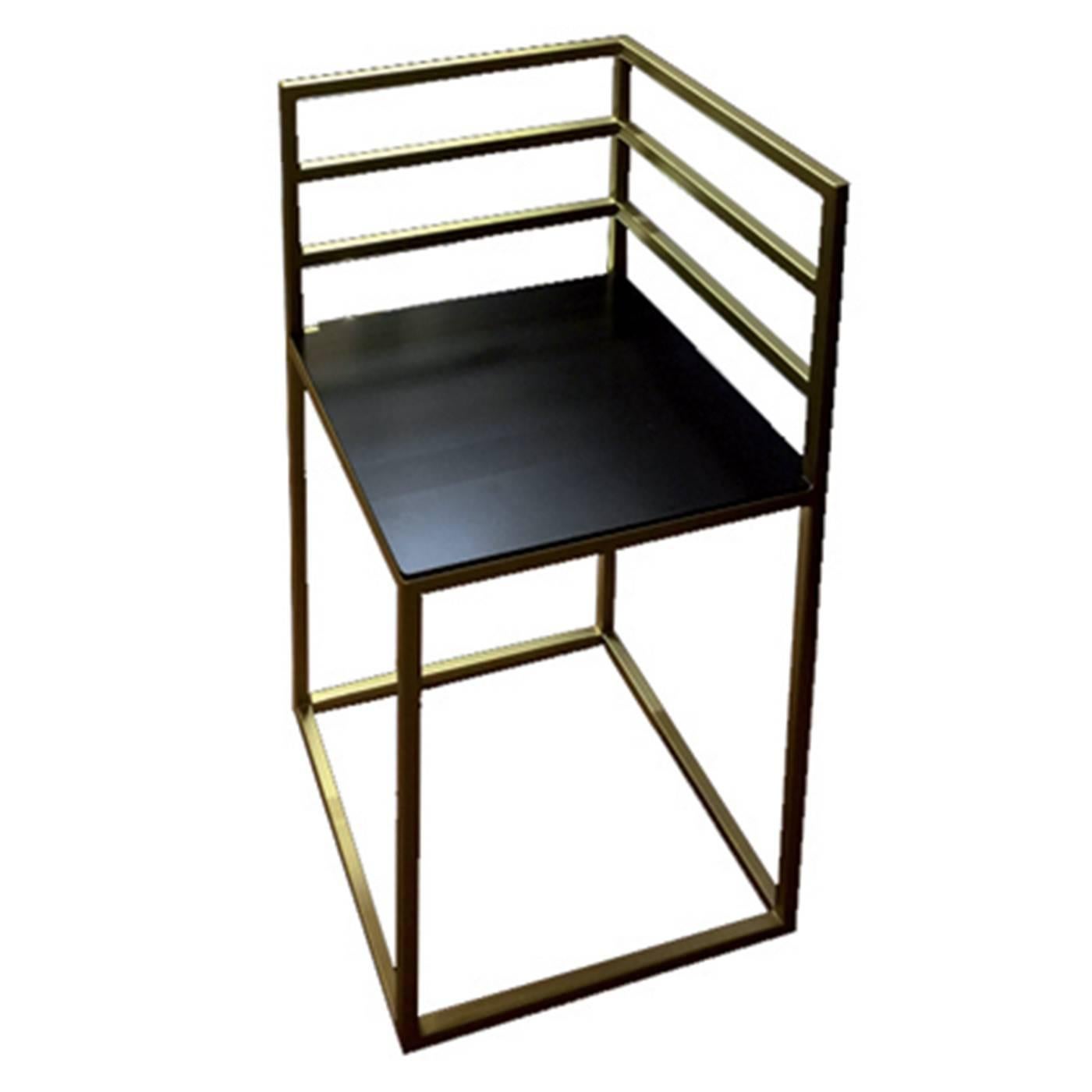 This exquisite chair features pure geometric lines that create a small chair that can stand alone or be paired with another to make a larger seat. The structure is in brass with a square section and the square seat is in copper. The two materials