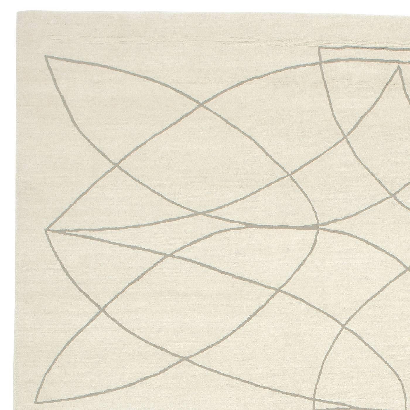 This exquisite 100-knot rug was knotted entirely by hand in Nepal using wool and bamboo silk. The natural white background is adorned with fine, elongated curves in grey that cross each other creating an elegant wool pattern that will enrich any