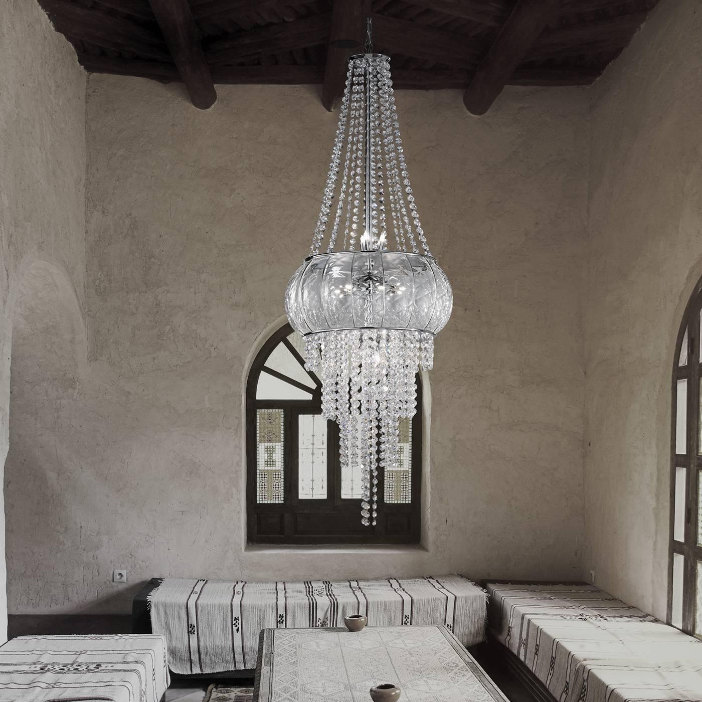 This superb chandelier will make a statement in any decor, providing a luxurious source of light for a large room. Its exquisite craftsmanship is evident in the mouth-blown Murano glass central structure with its texture enriched by the 