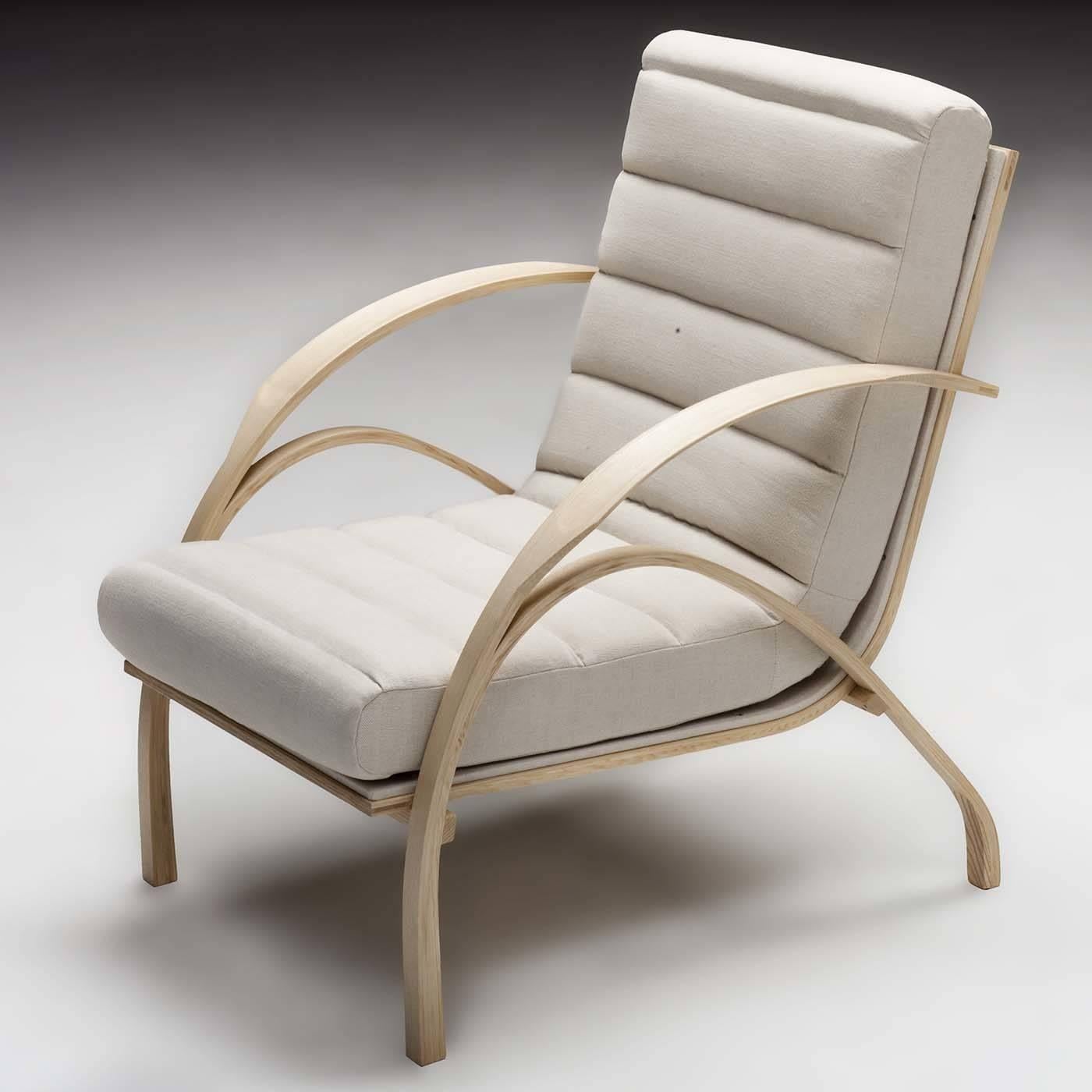 This armchair features a sinuous frame that cradles the comfortable seat and back cushions for ultimate comfort and style. This exquisite piece was originally designed in 1957 by master designer Carlo De Carli. In 2011 it was presented by La