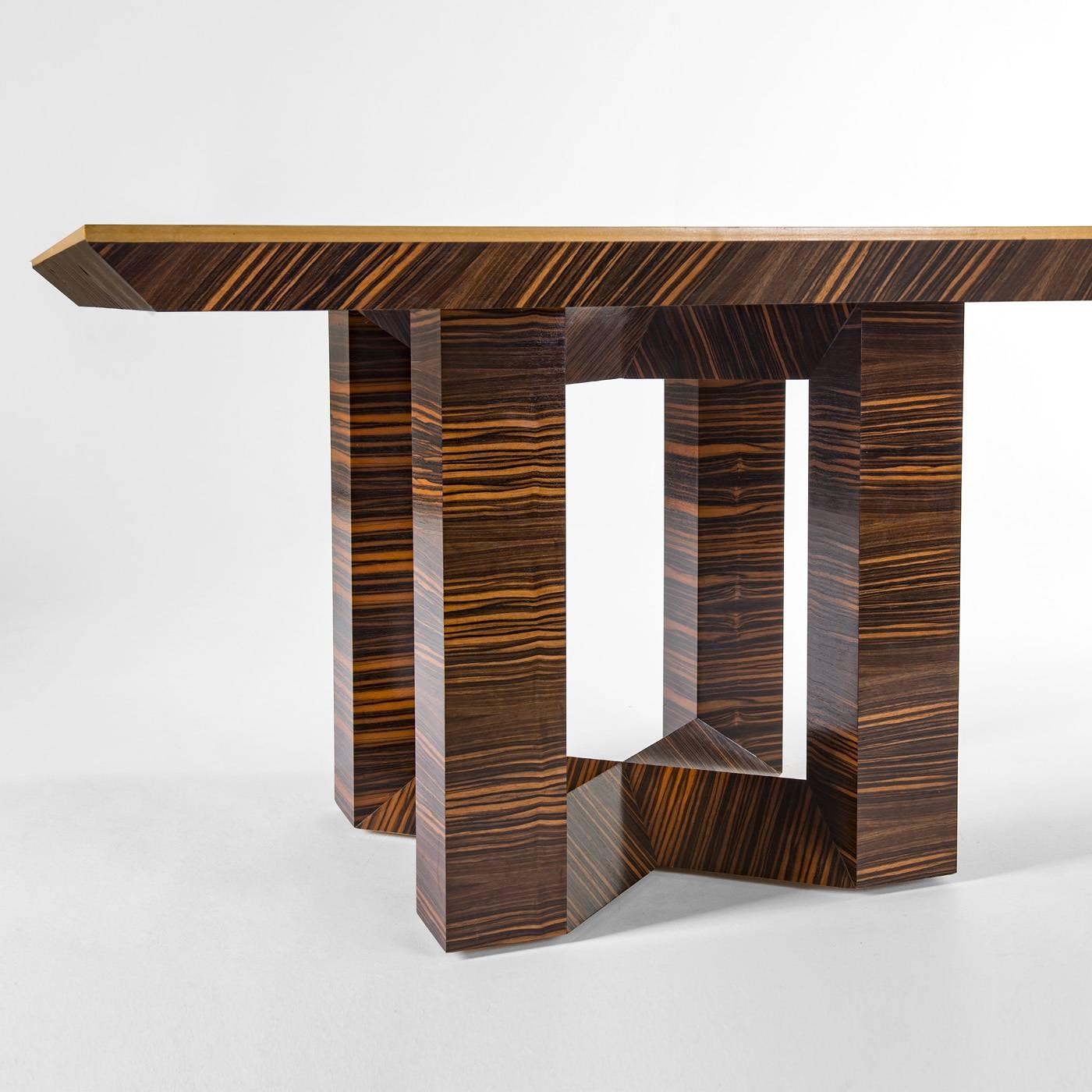 This square table features a unique look that will make a statement when placed in any home. The structure of the tabletop was crafted in ebony Macassar wood, which has been worked using a interwoven technique creating alternating grain patterns.