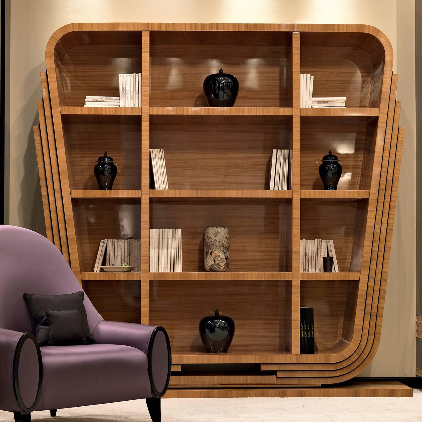 Inspired by the bold geometries and sophisticated style of Art Deco designs, this bookcase was made entirely in citronnier wood, whose yellow and orange glow will add a warm accent to any room. The piece features three vertical unmovable shelves