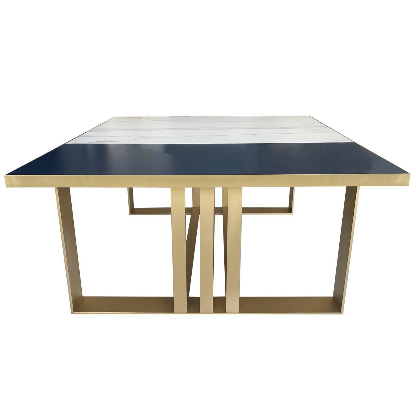 Sophisticated and timeless, this dining table will make a statement in any decor. It was made by expert artisans using a precious top in gold Calcatta marble that, with its light background and the signature golden veins, will add a luxurious touch