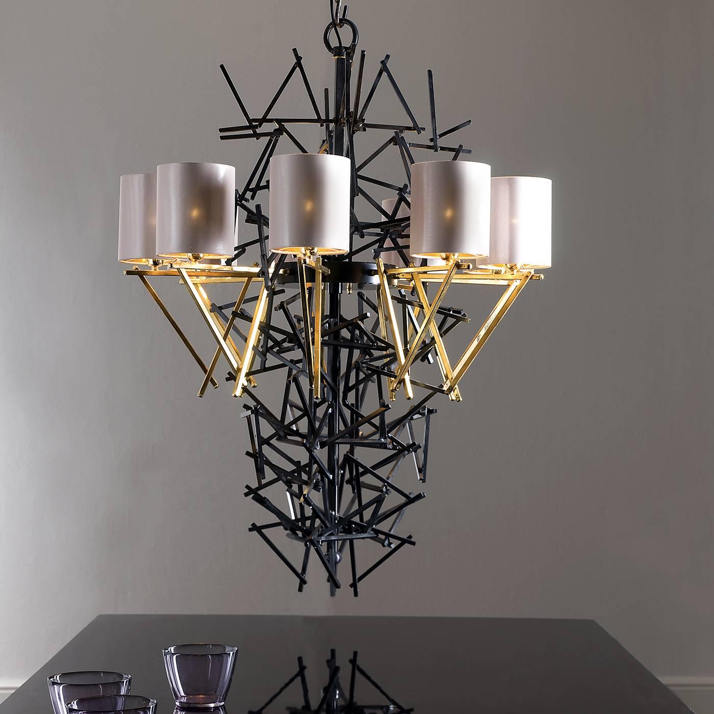 The striking design of this unique chandelier will make a striking statement when placed in a home and it is also ideal for use in public spaces. Its construction consists of a variety of chopstick-shaped rods of iron which have been soldered