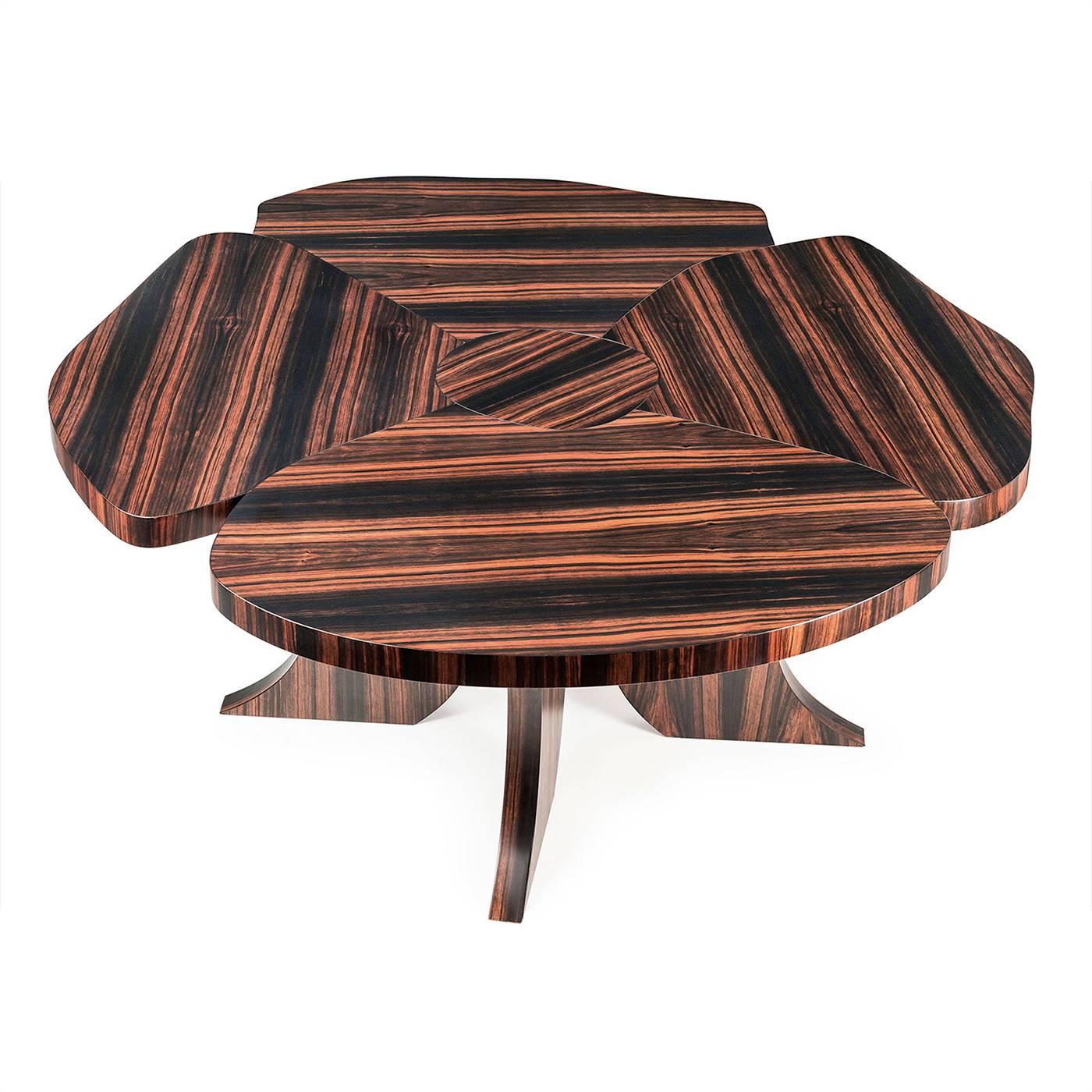 Part of the Andy collection, this table is made entirely in precious ebony wood with a lacquered finish that enhances the natural veins of the wood. The curved four legs and the top, in the shape of an opened flower, are staples of the Andy series