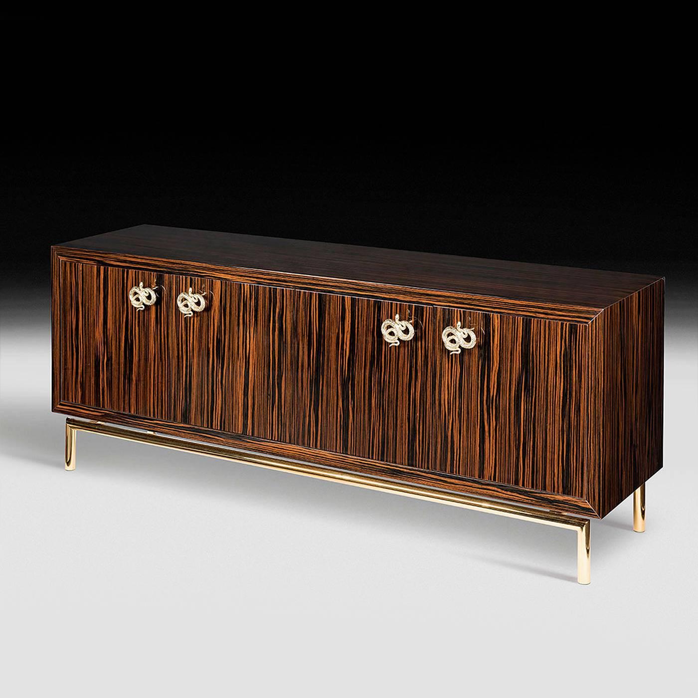 This refined four-door sideboard is part of the Original Sin collection created by designer Giorgio Ragazzini for VG. Its structure is made in authentic ebony wood with a glossy finish and 45-degree junctions. The edges and back have glossy brushed