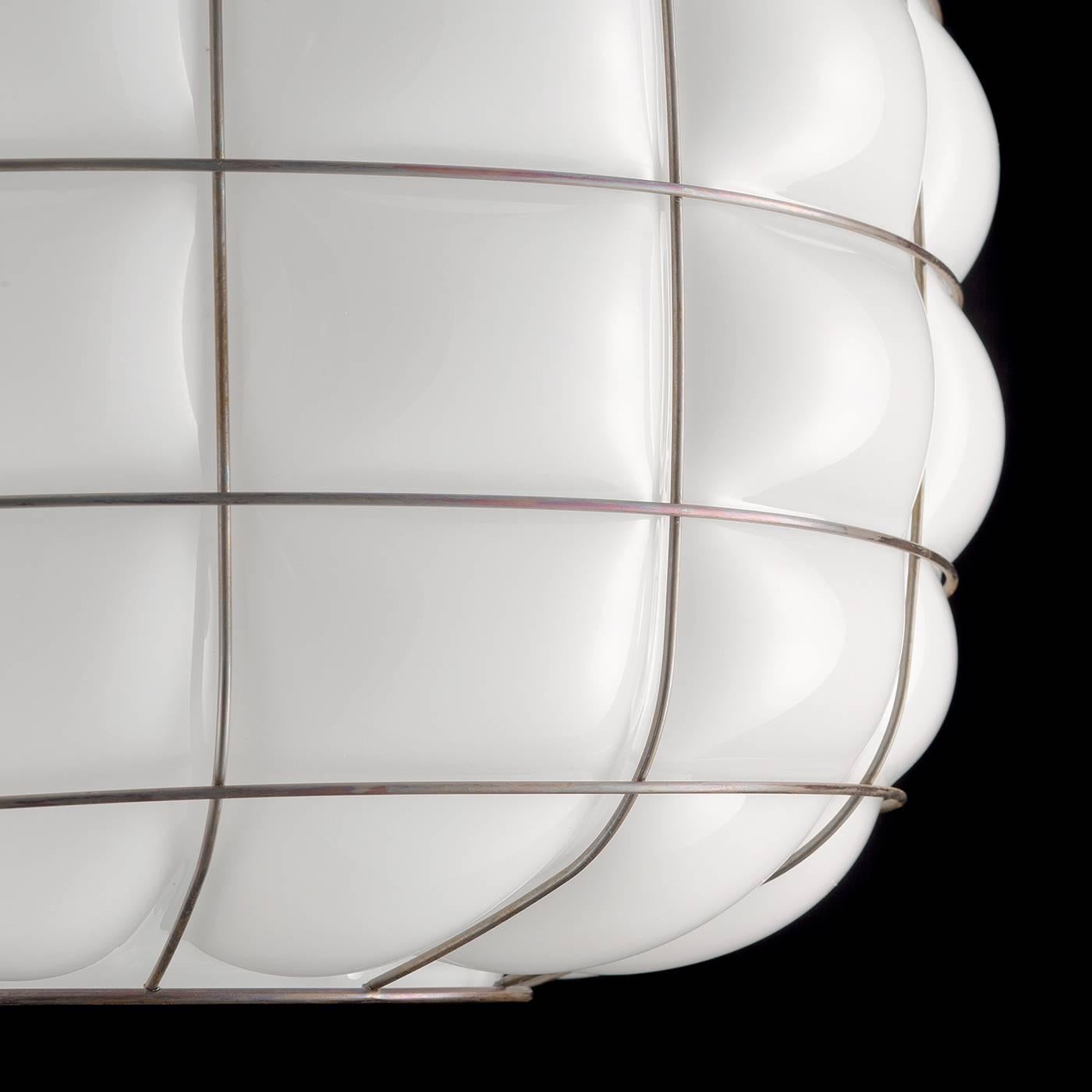 This exquisite ceiling lamp is made according to the artisanal methods developed in Murano for centuries. Its bronzed steel structure encapsulates the white mouth-blown glass shade so that the glass bulges out, creating characteristic curved wedges.