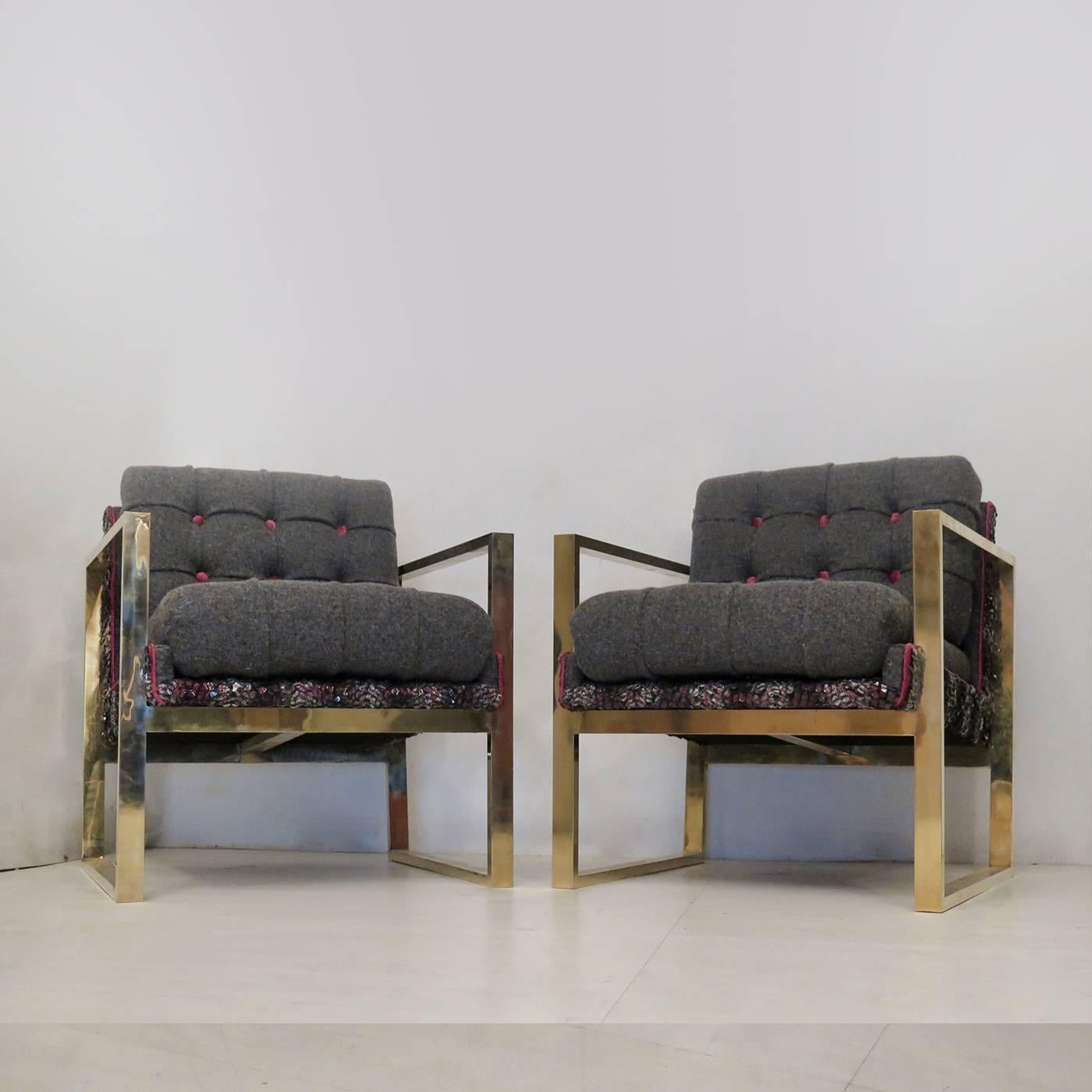 This exemplary set of armchairs will make the perfect addition to any home when placed in a contemporary room. The geometric brass structure strikingly contrasts with the soft curves of the comfortable cushions. The bases of seat and backrest in