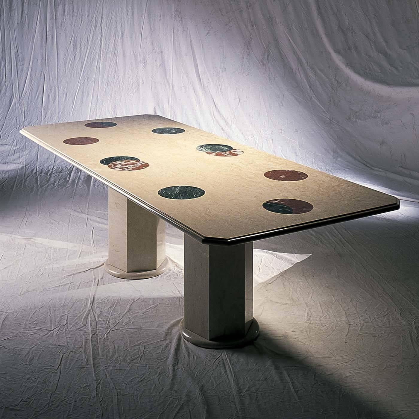 Pleasant lines, elegant materials, and vibrant colors make this table a captivating piece capable of standing out in any decor. The top, made of a solid piece of Perlato di Sicilia, has a rectangular shape with tapering corners, and features six