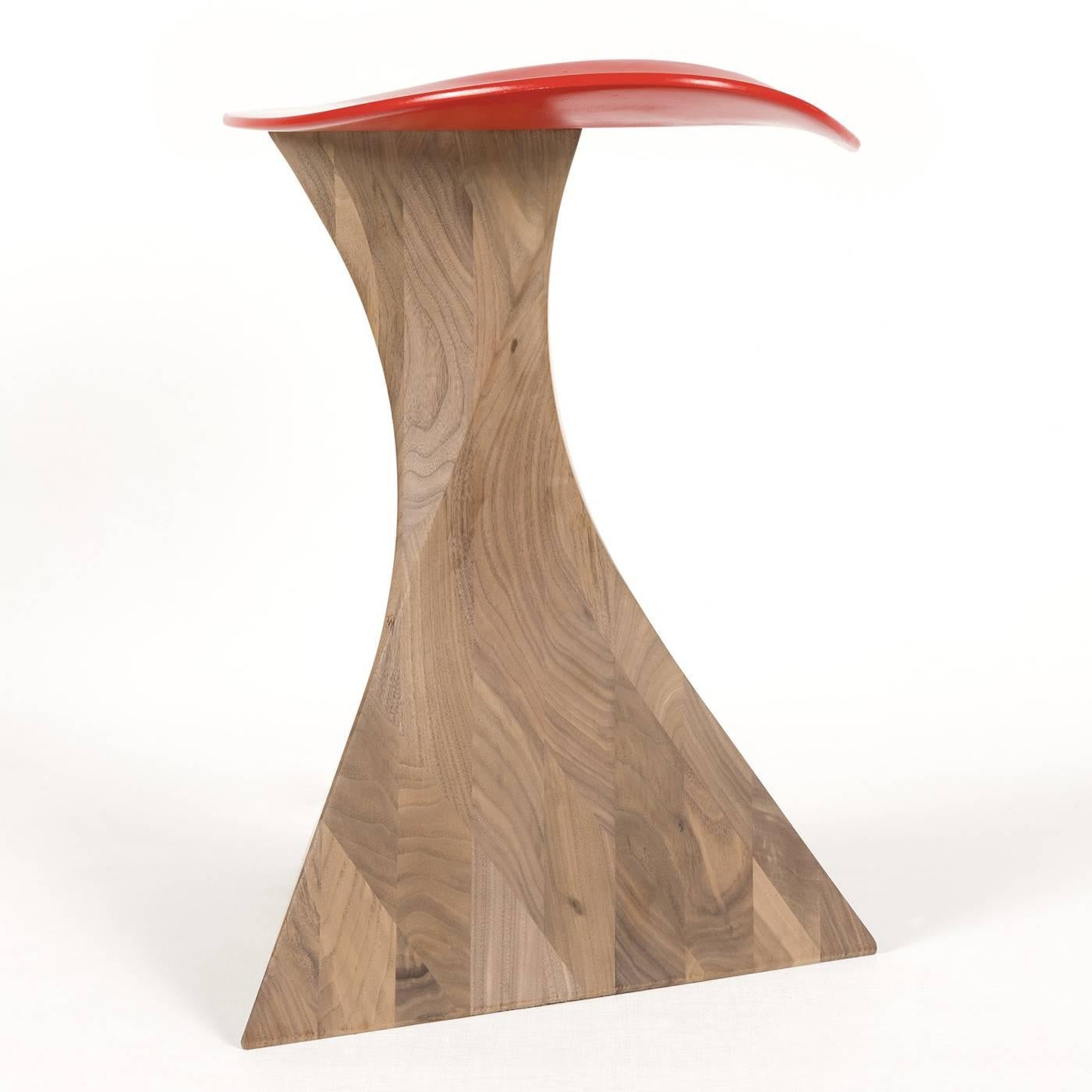 A harmonious union of design and functionality, this stool will add a touch of elegance to any room or study. Its geometric hourglass pedestal is rendered in solid walnut wood, and its faceted sides gracefully contrast with its curved silhouette.