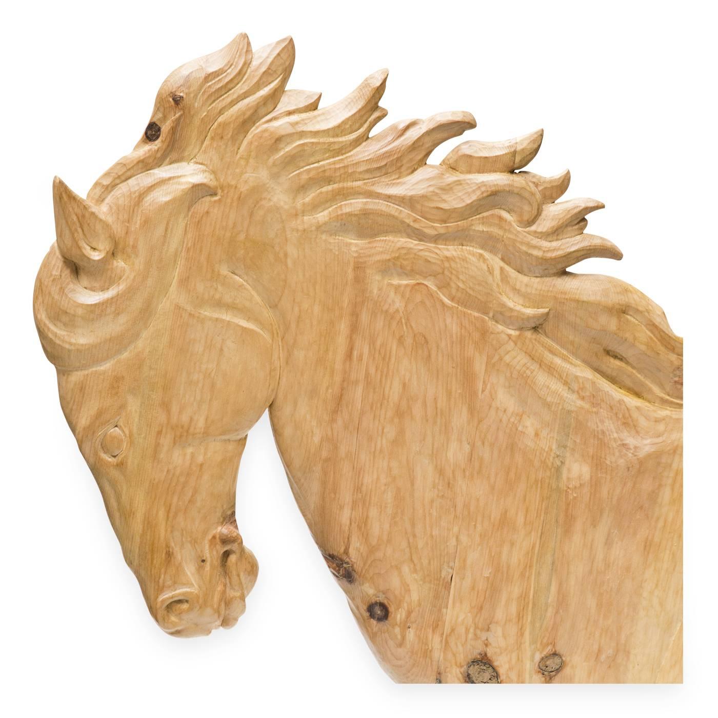 This powerful piece by Bartolozzi e Maioli is a wall decoration portraying an impressive horse mid stride. The sculpture is masterfully hand-carved in Austrian pine, having been originally designed in 1968 for an architecture studio in Zurich.