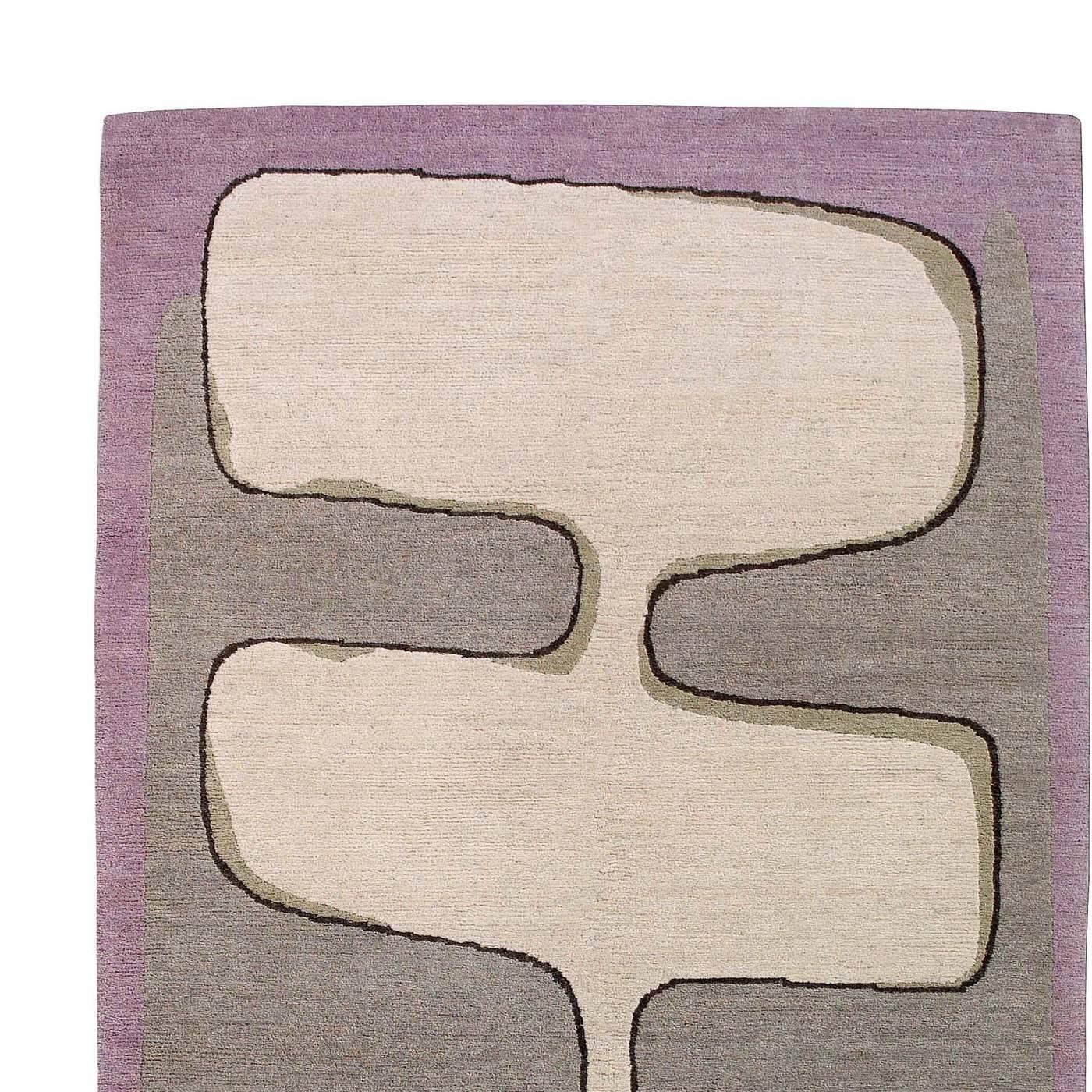 Simple and delicate, this wool carpet was designed by M. Iosa Ghini and was hand-knotted by master artisans in Nepal. The traditional knot used to Craft this rug, which is one of a 36-piece limited series, and the high quality of the Tibetan wool