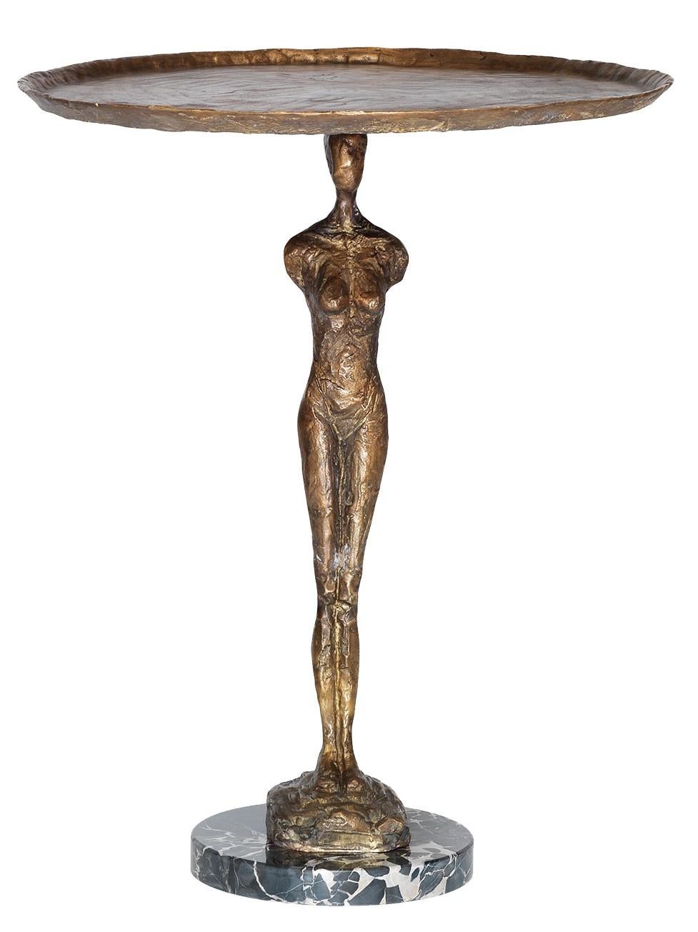 An eye-catching piece, this lavish side table will add timeless glamour to any decor. Made of bronze with an antiqued finish, the sleek Silhouette features a delicate square tray supported by a slender Silhouette of a woman, reminiscent of the