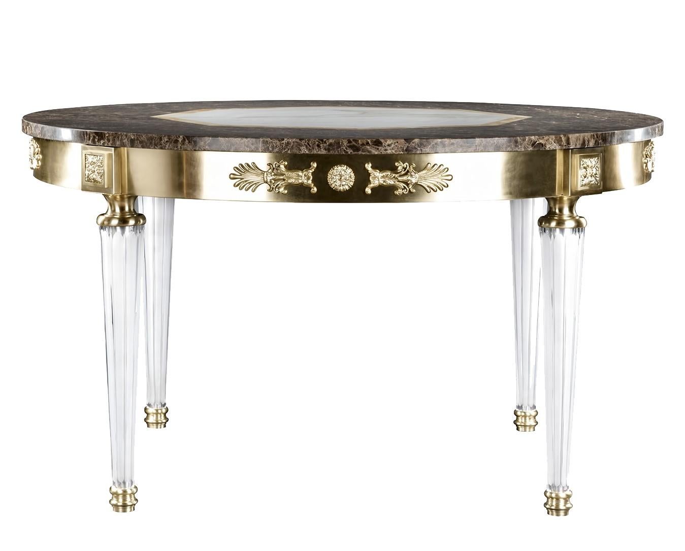Fine details and precious materials define this sophisticated table of neoclassic inspiration. A striking slab of Emperador marble with an hexagonal Calacatta marble centre and Siena yellow inlays graces the round top, supported by handcut crystal
