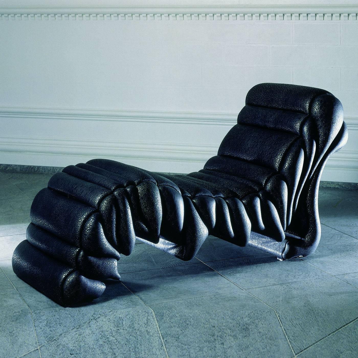 This striking work of art that is also a functional furniture piece was designed by Roberto Fallani to resemble the powerful lava slowly pouring on a hilly surface. The wooden structure supports a series of foam pillows covered by a dark-colored