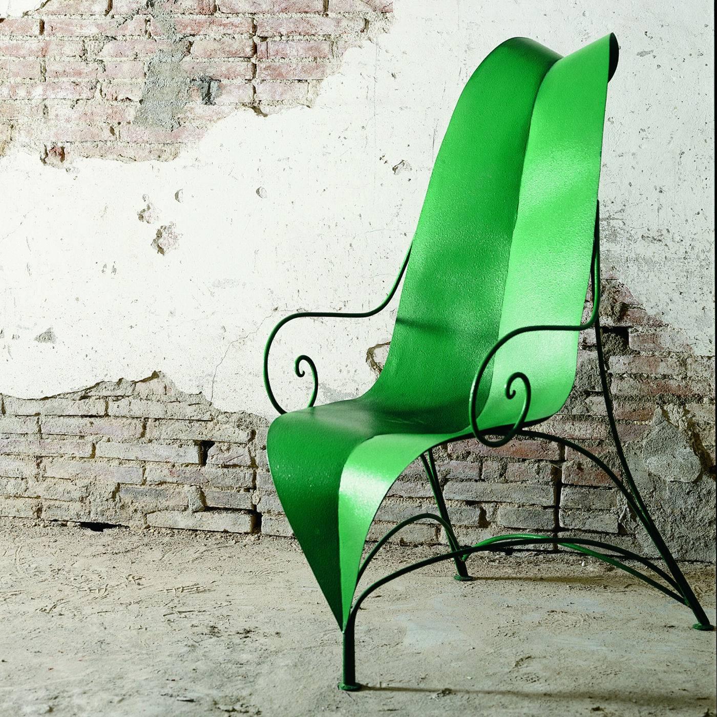 This charming armchair was designed by Fabrizio Corneli and was entirely crafted by master artisans using iron. The striking seat and back are one piece that is shaped and colored to resemble a gigantic leaf in vivid green. The base consists of