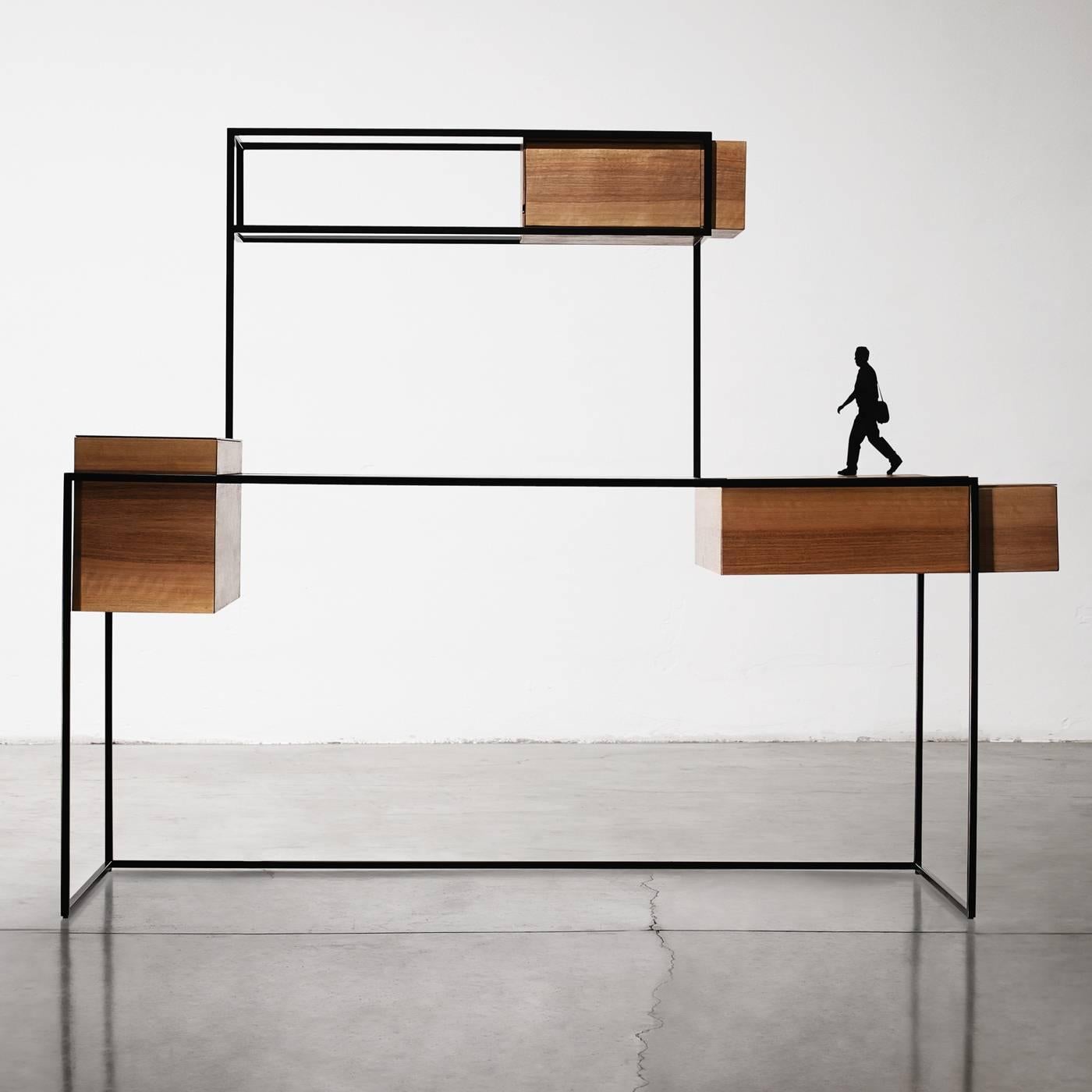 A minimal look and clean design characterize this desk which has three walnut compartments. The components are a desktop made of ultra-clear plate glass, a top cupboard that opens with a hinged door, a cupboard on the left that opens with a trap