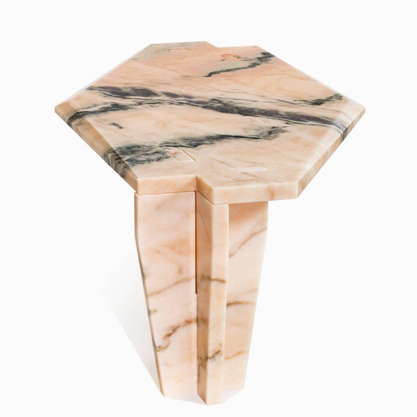 This elegant table is entirely made in pink Portugal marble that is 2 cm thick. The hexagonal top rests on two legs with joints that don't require glue or screws. It can also be made in green Guatemala, Calcatta gold, white Carrara, grey Carnico, or