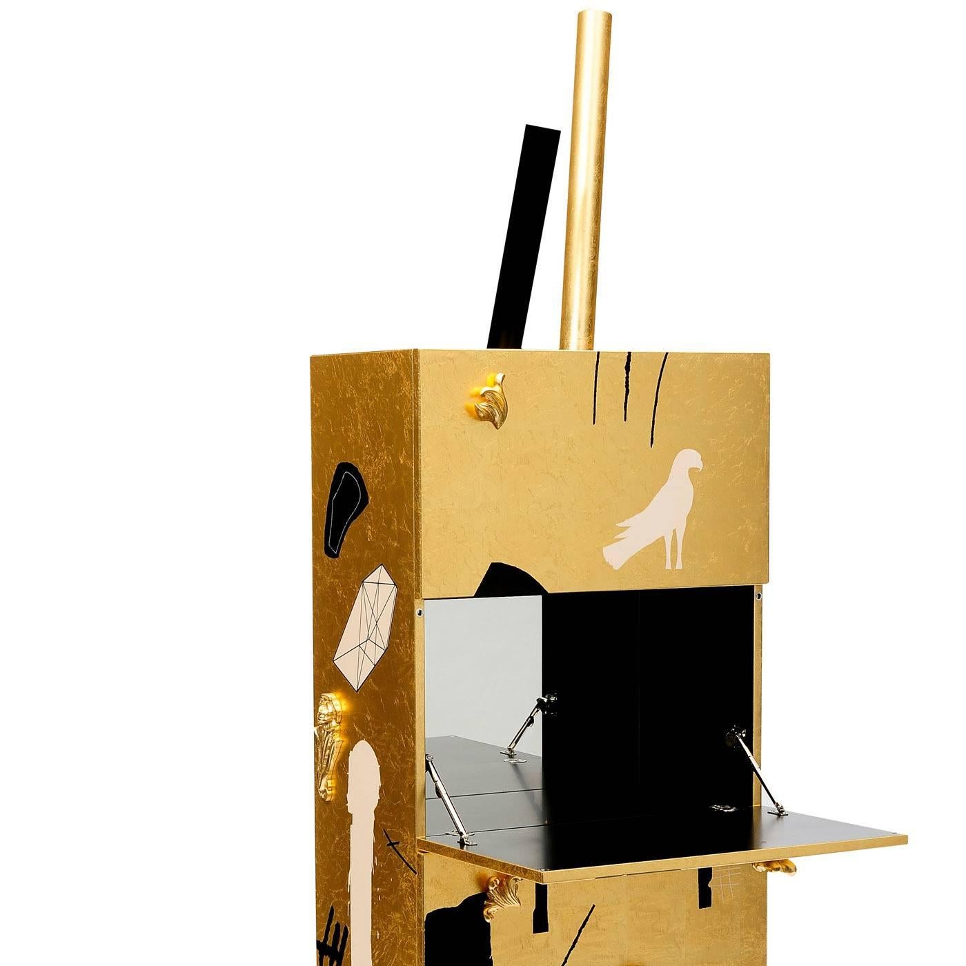 This cabinet bar was crafted entirely in MDF wood and its surface was covered in a layer of gold leaf and then decorated by hand with various designs in black and white by Mimmo Paladino. The piece features three openings, which can be accessed by