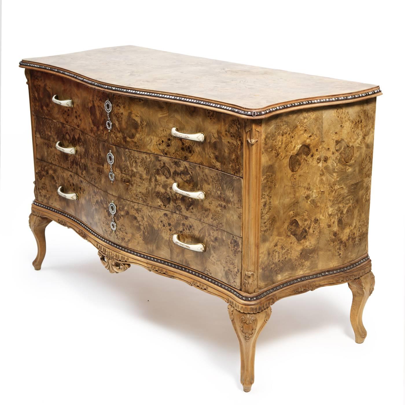 This exquisite dresser is part of the radical chic series, distinctive for its soft lines and precious materials. The classically inspired Silhouette in walnut root was restored to its natural state and boasts the striking natural patterns of the