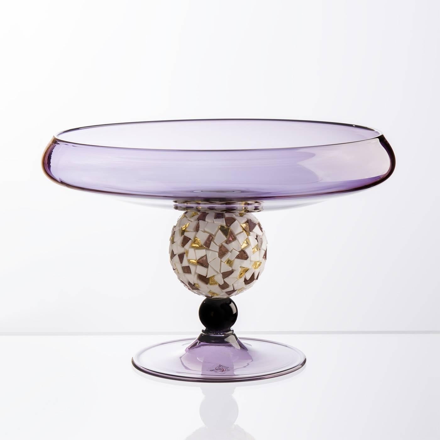 This exquisite centerpiece is made of Murano mouth-blown glass in amethyst color and features a pedestal with a small glass sphere in the same amethyst color surmounted by a large crystal sphere covered with a mosaic of tesserae made of 24-karat