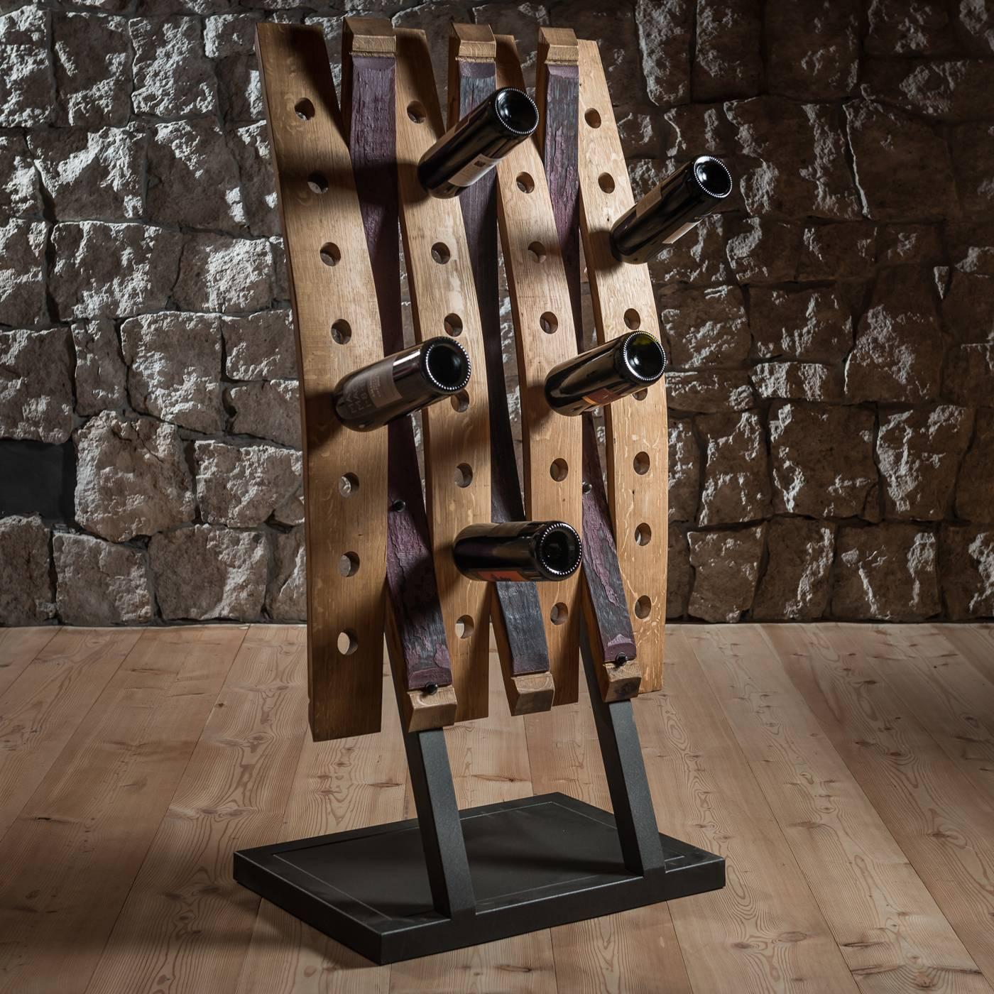 Handcrafted with parts of wood barrels used to ferment Amarone wine, the staves used for this unique wine rack were selected specifically for the rich violet nuance inherited from the wine they contained. Seven slates are intersected facing each
