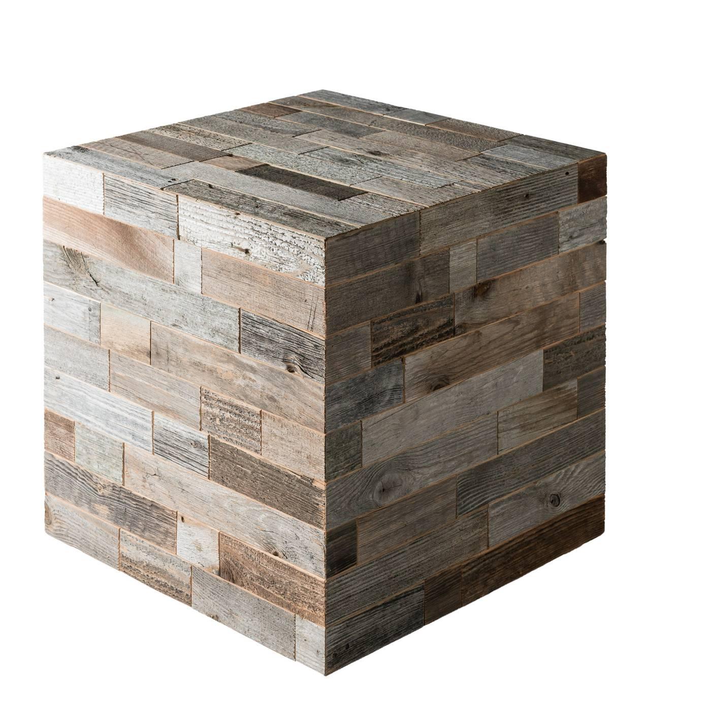 This contemporary design performs a dual function: decorative and functional. Its cubic shape is made of strips of wood recovered from the beams and planks of old barns that are restored by hand and have a different color resulting from exposure to