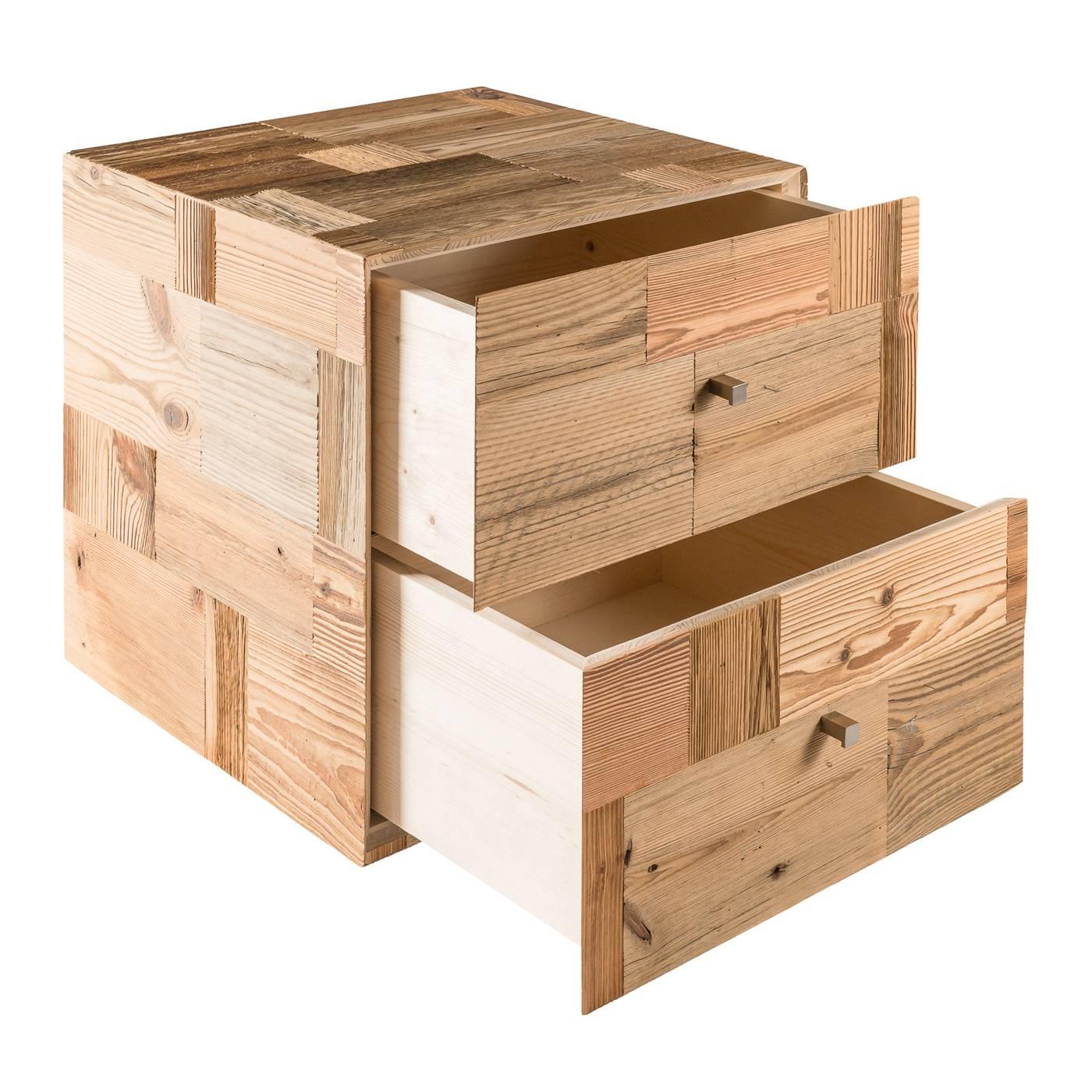 Sophisticated and unique, this cubic furniture piece is a striking example of functional design as it performs a Dual function as an accent piece and storage. The wood is entirely handcrafted from recovered and restored planks of old barns, whose