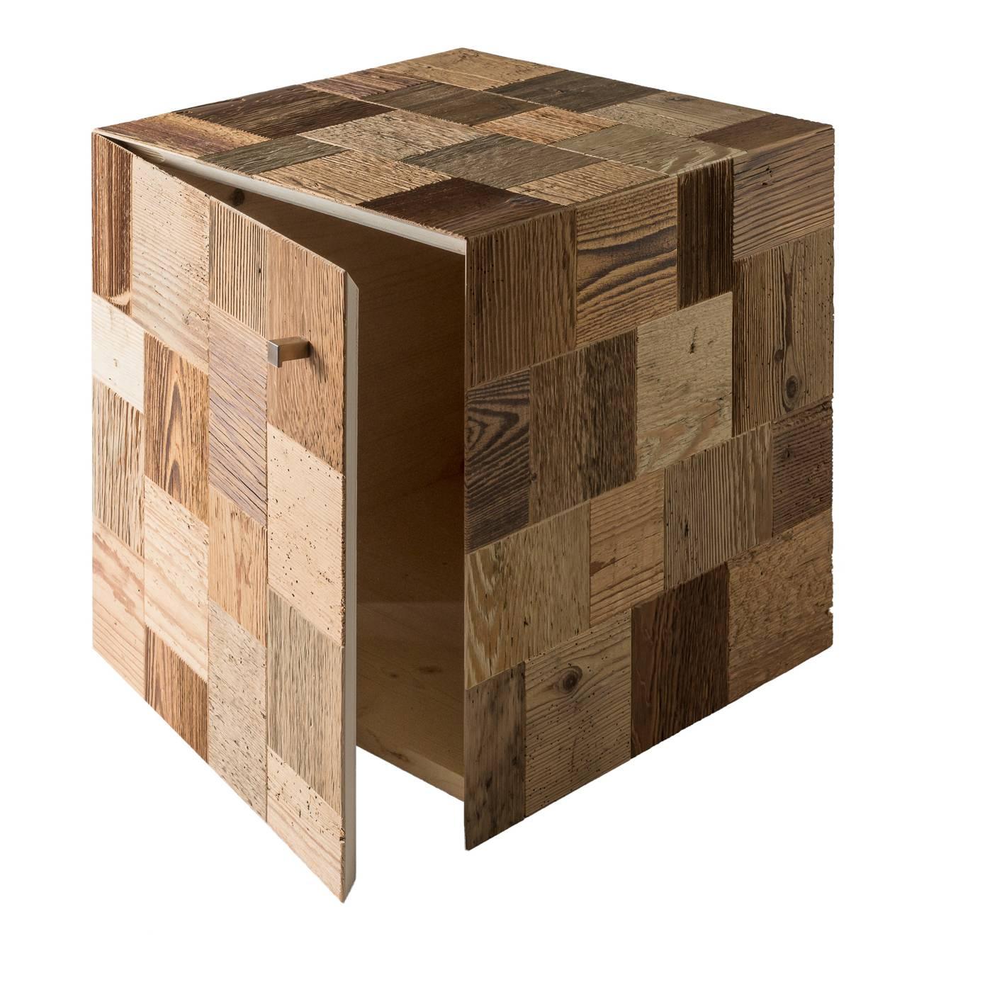 Functional design at its utmost expression, this cubic piece of furniture performs a Dual function as an accent piece and storage cabinet. The wood entirely handcrafted from recovered and restored planks of old barns, whose colors result from